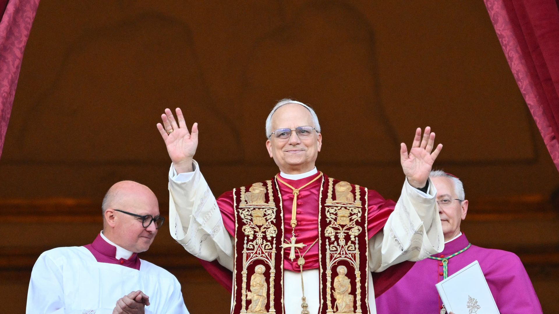 Newly elected Pope Leo XIV, Robert Francis Prevost arrives on the main central loggia balcony of the St Peter's Basilica for the first time, after the cardinals ended the conclave on May 8, 2025. (Photo by ALBERTO PIZZOLI/AFP via Getty Images)