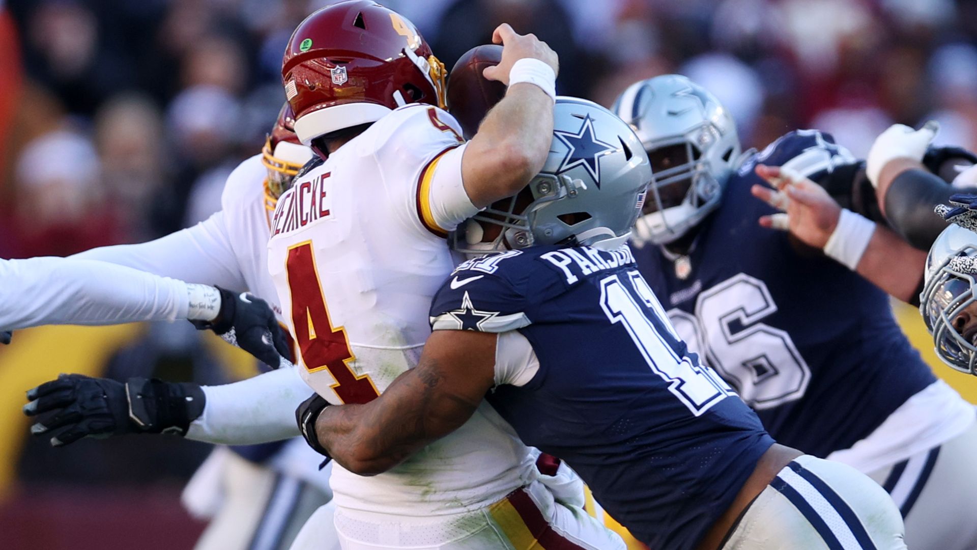 The Washington QB is getting sacked and fumbling.