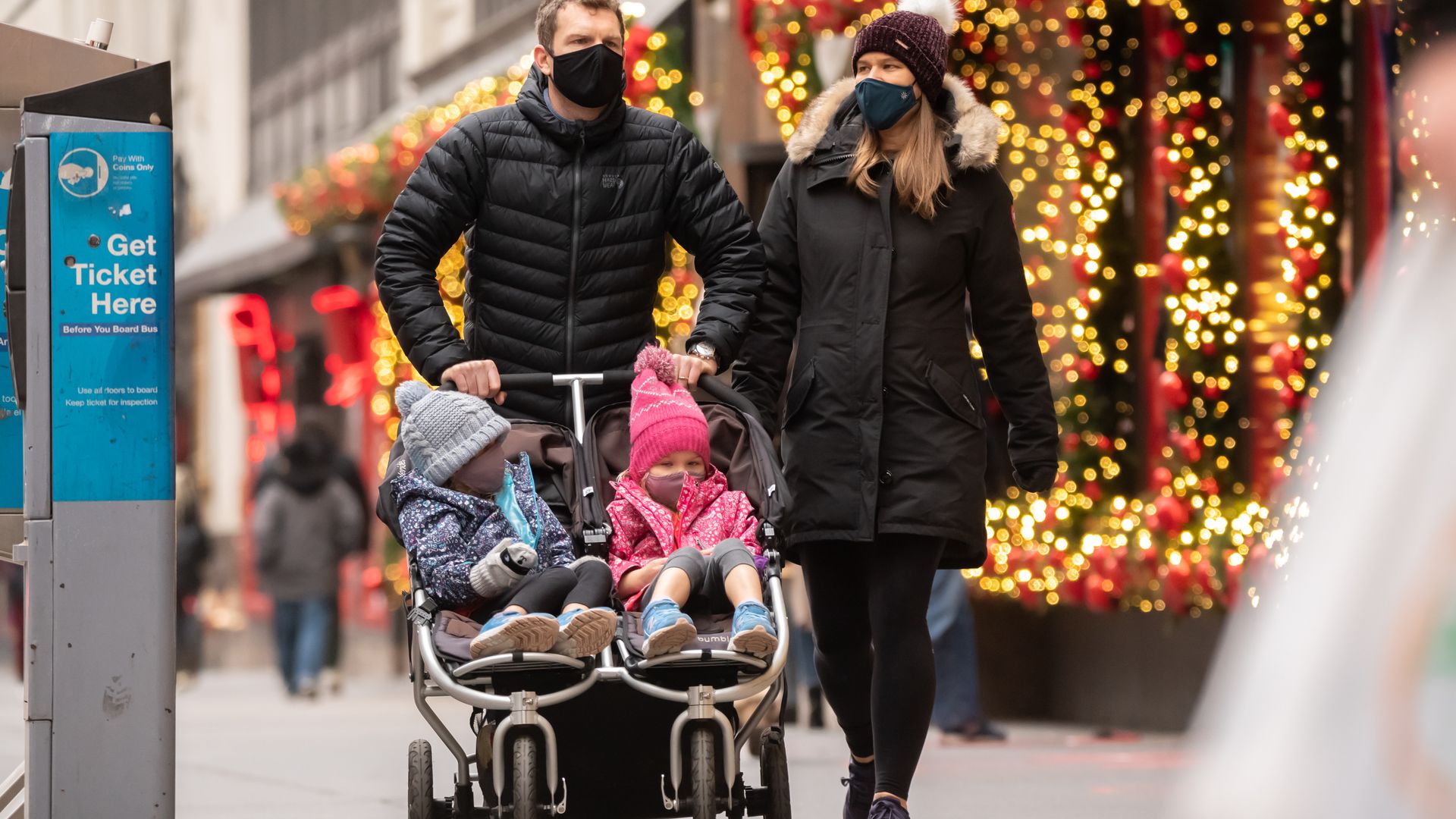 People pushing a stroller in NYC