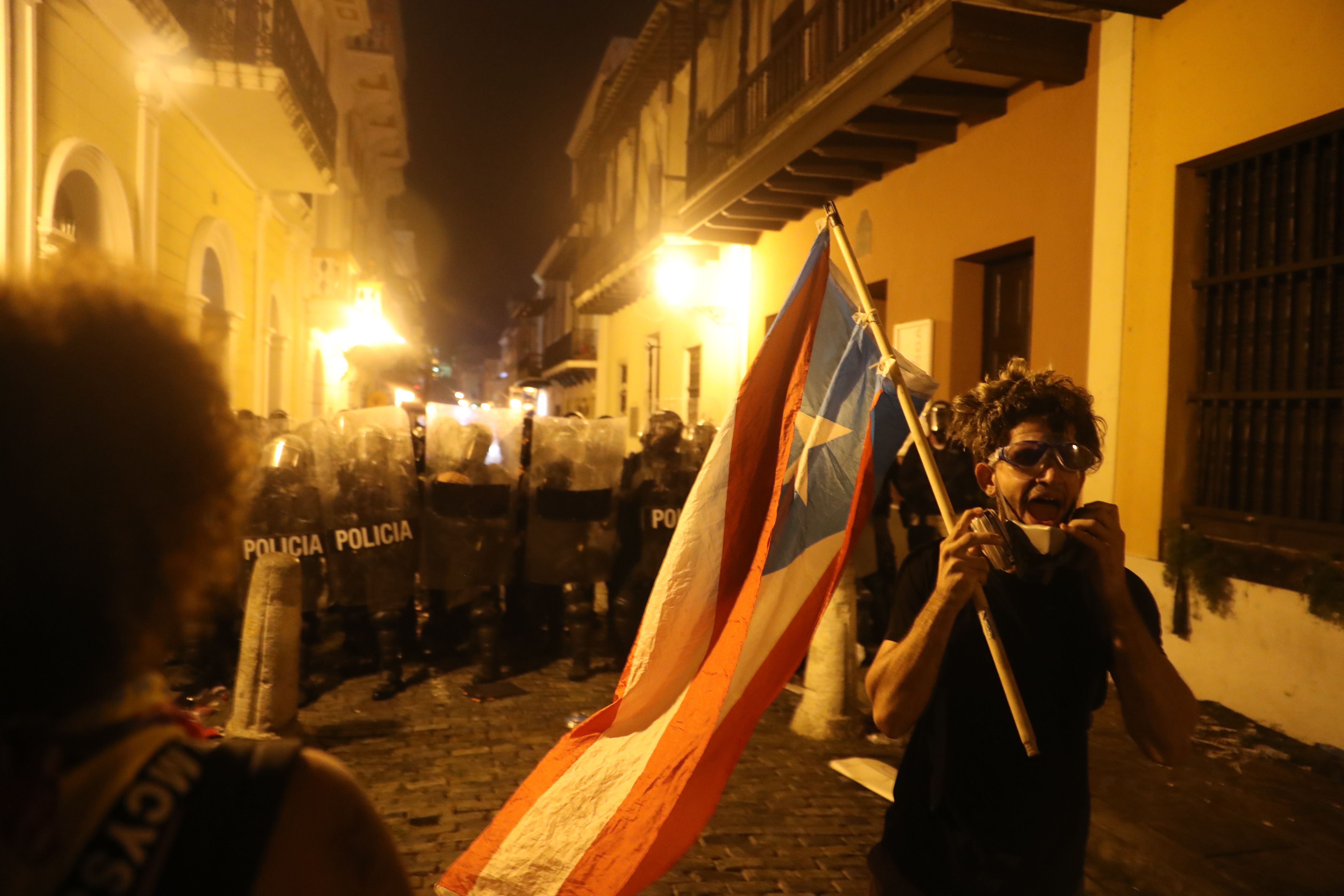 Demonstrators and police face off during a protest against Ricardo Rossello, the governor of Puerto Rico on July 17, 2019 in Old San Juan, Puerto Rico.