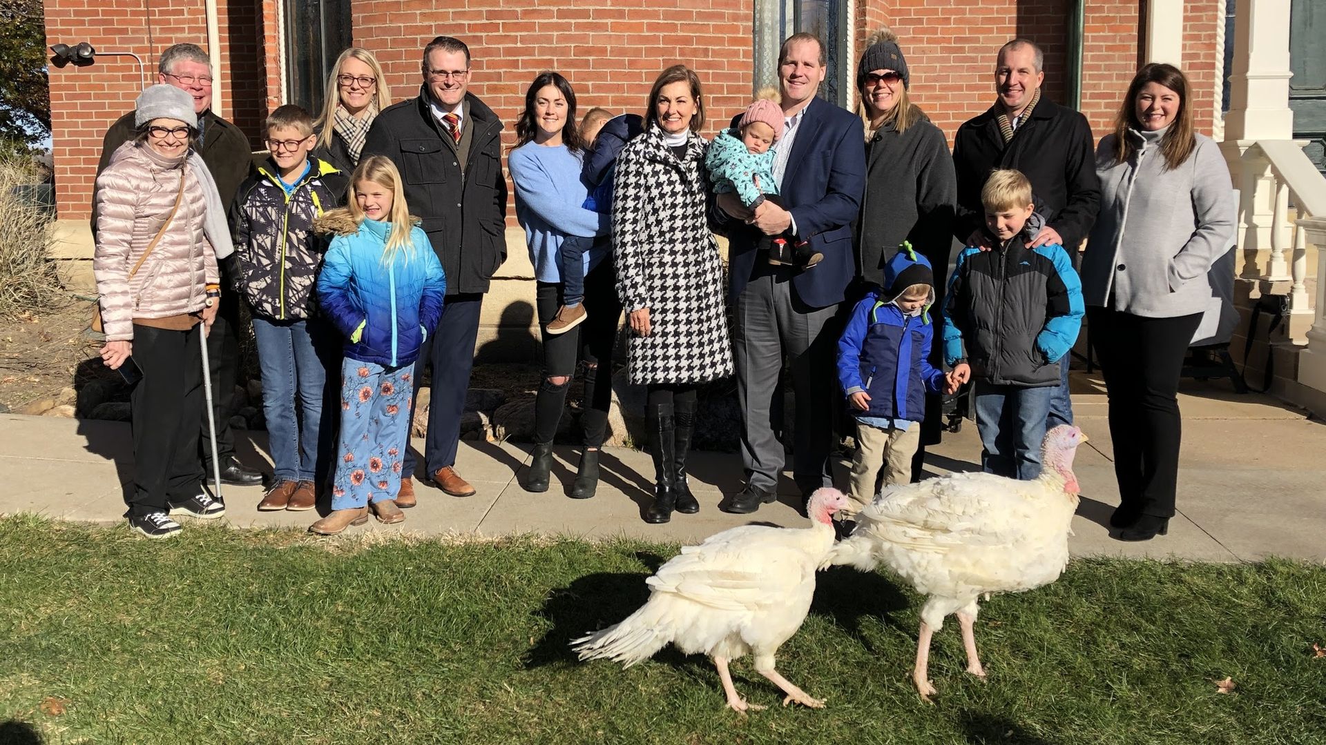 Gov. Kim Reynolds and two turkeys