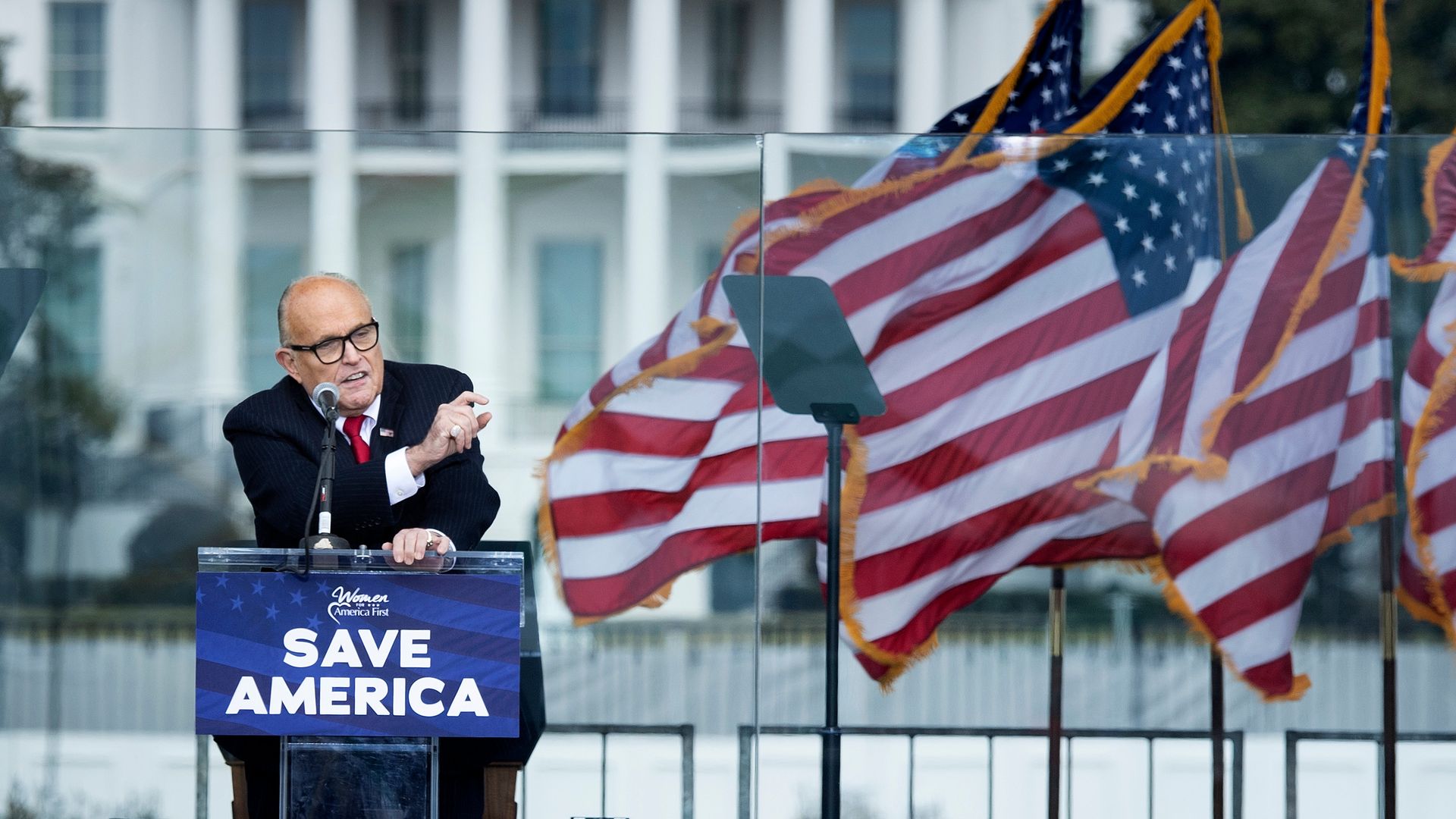 Rudy Giuliani at a podium.