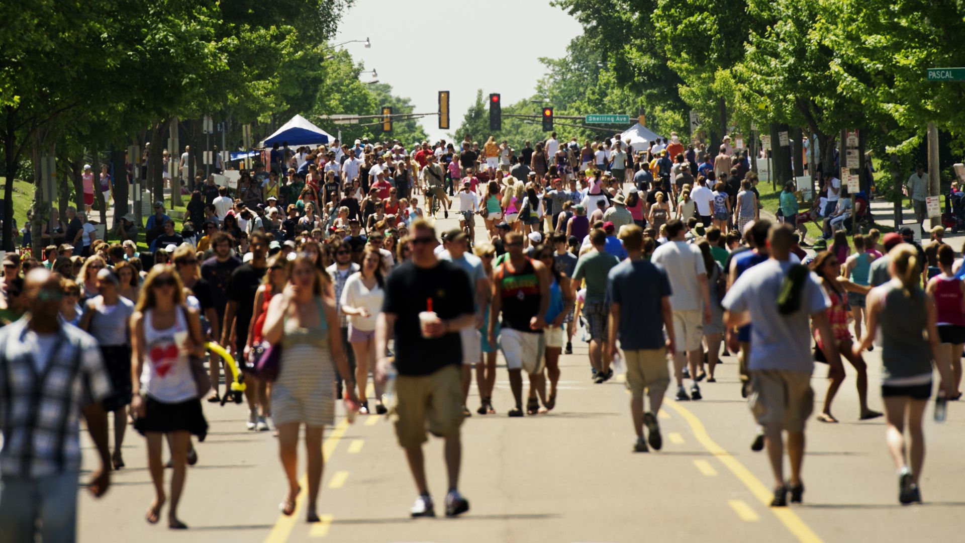 A group of people in the street on Grand Avenue in St. Paul.
