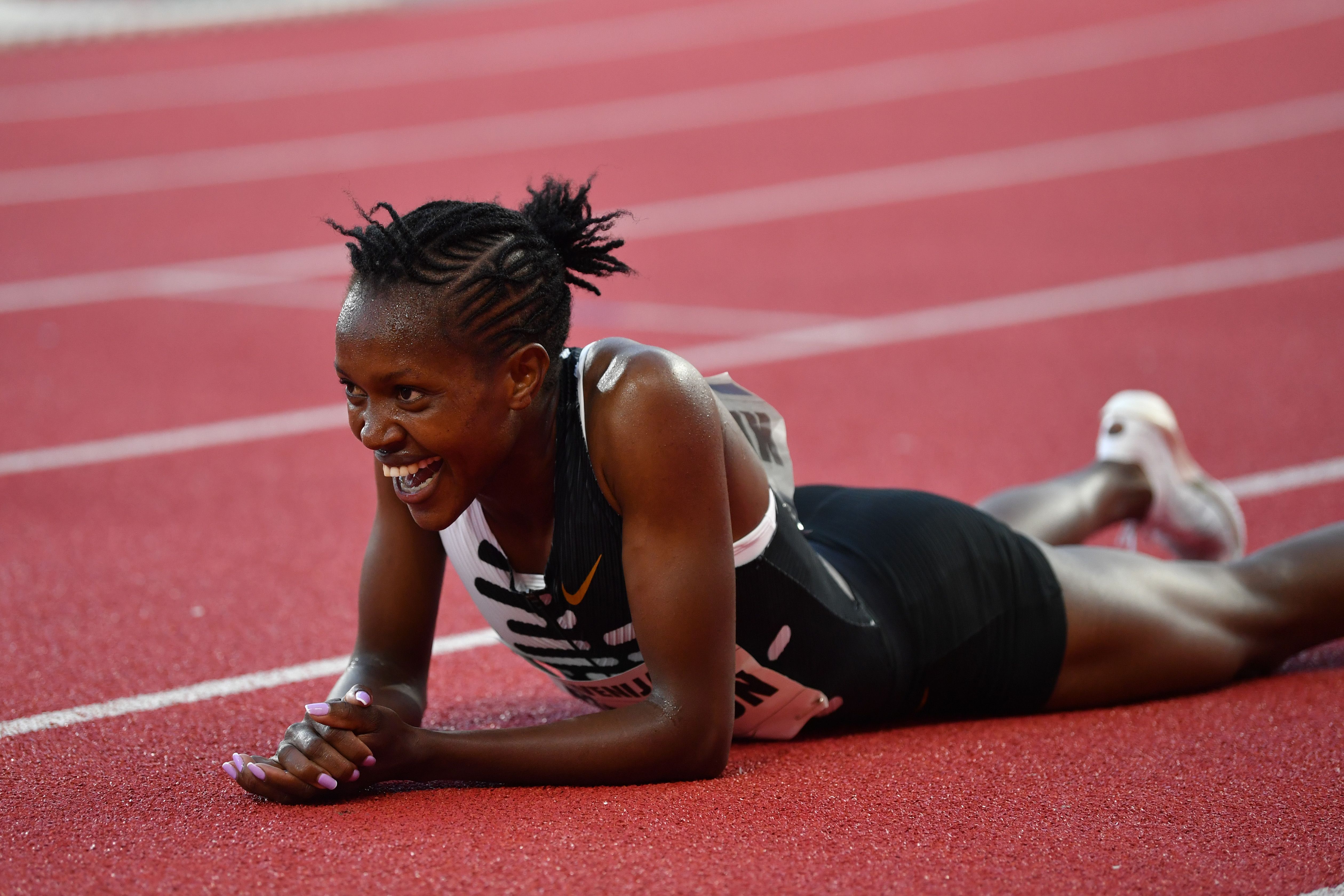kipyegon smiling on the track