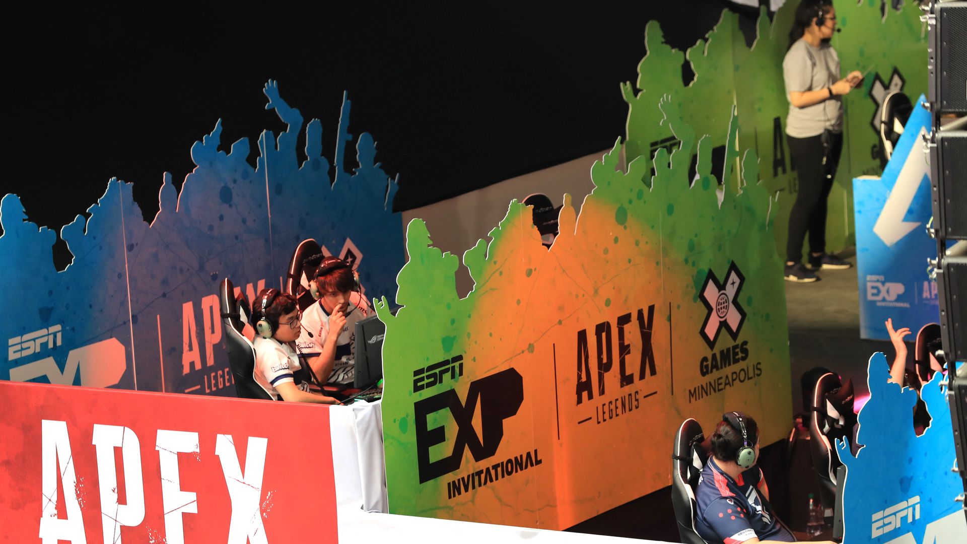 Image shows gamers at an Apex Legends event.