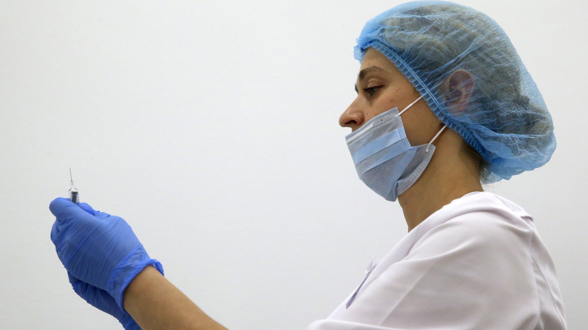 A doctor preparing vaccinations