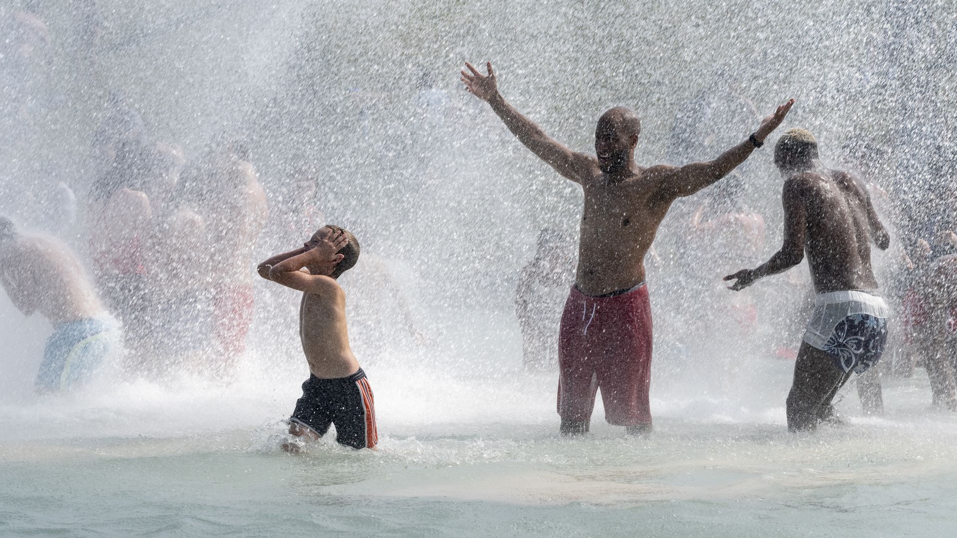 Three men in a fountain.