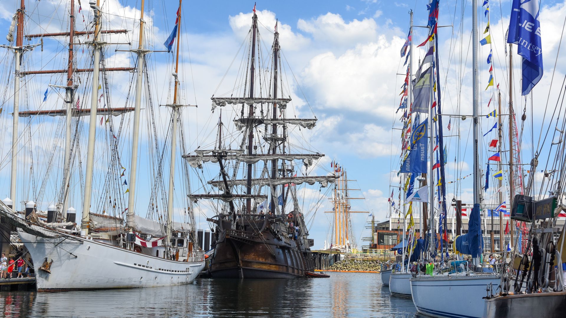 Several tall ships are in the Boston Harbor as part of the 2017 Tall Ships celebration.