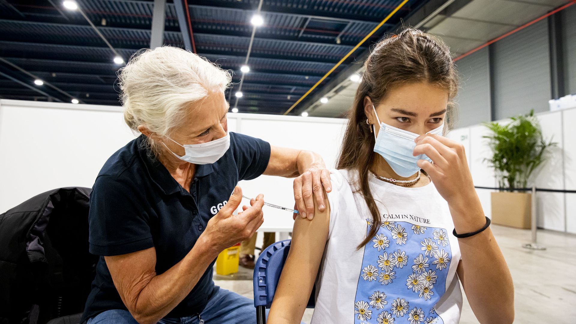 A child is seen while receiving a coronavirus vaccination.