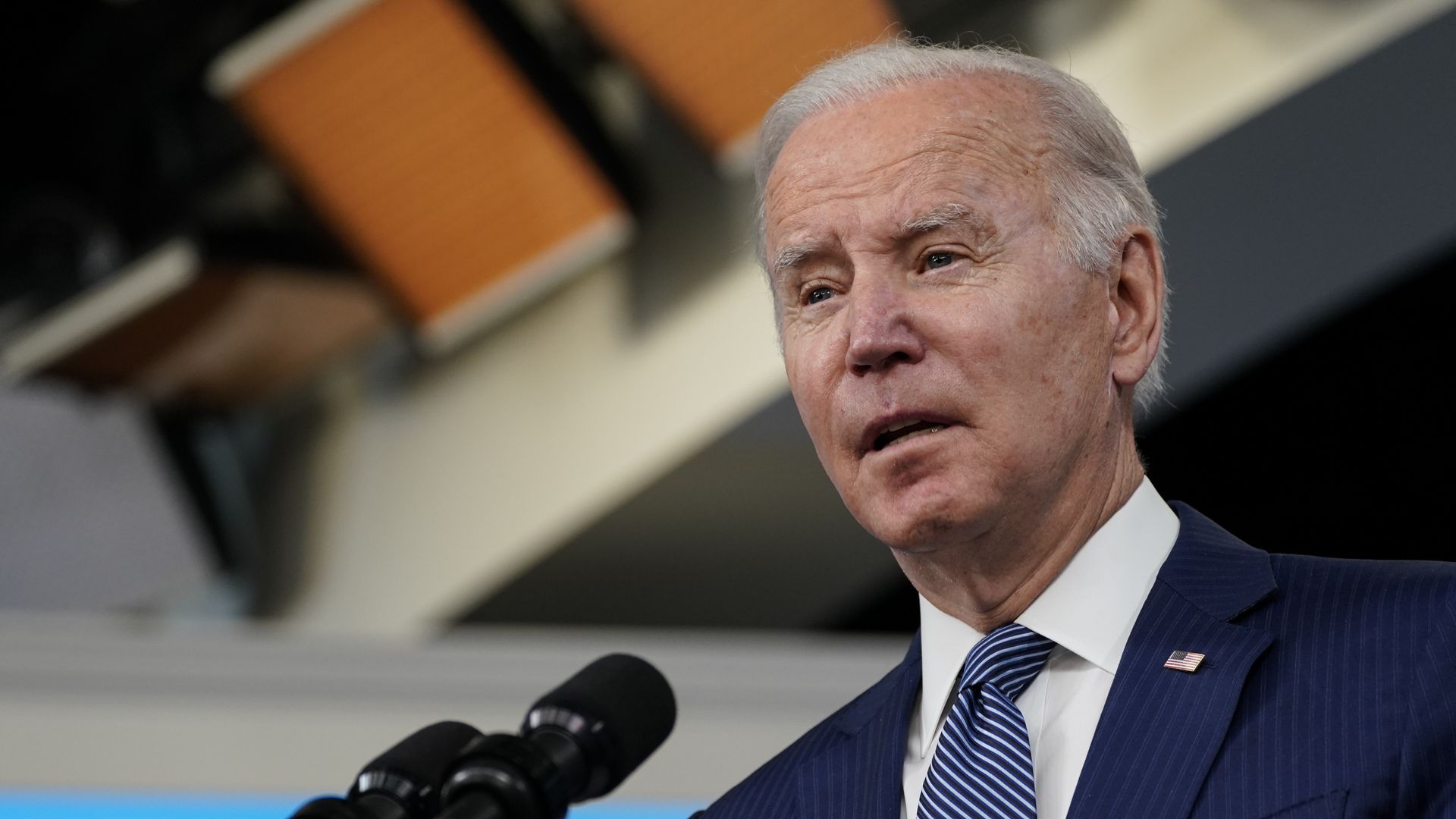 Photo of Joe Biden speaking into a microphone