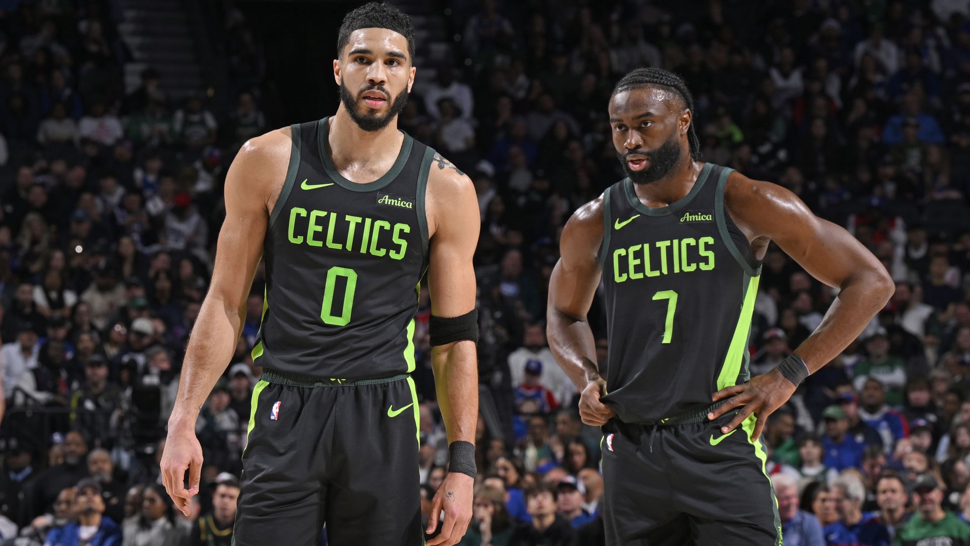 The Celtics' Jayson Tatum and Jaylen Brown stand together on the court during a recent game.