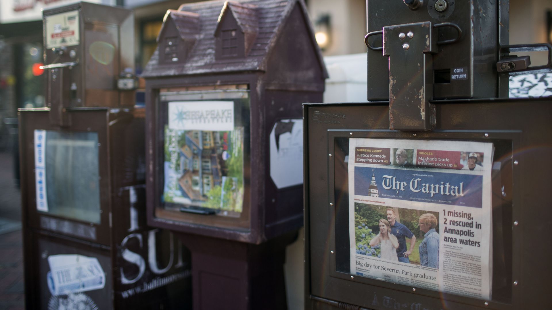 A newspaper stand selling the Capital Gazette.