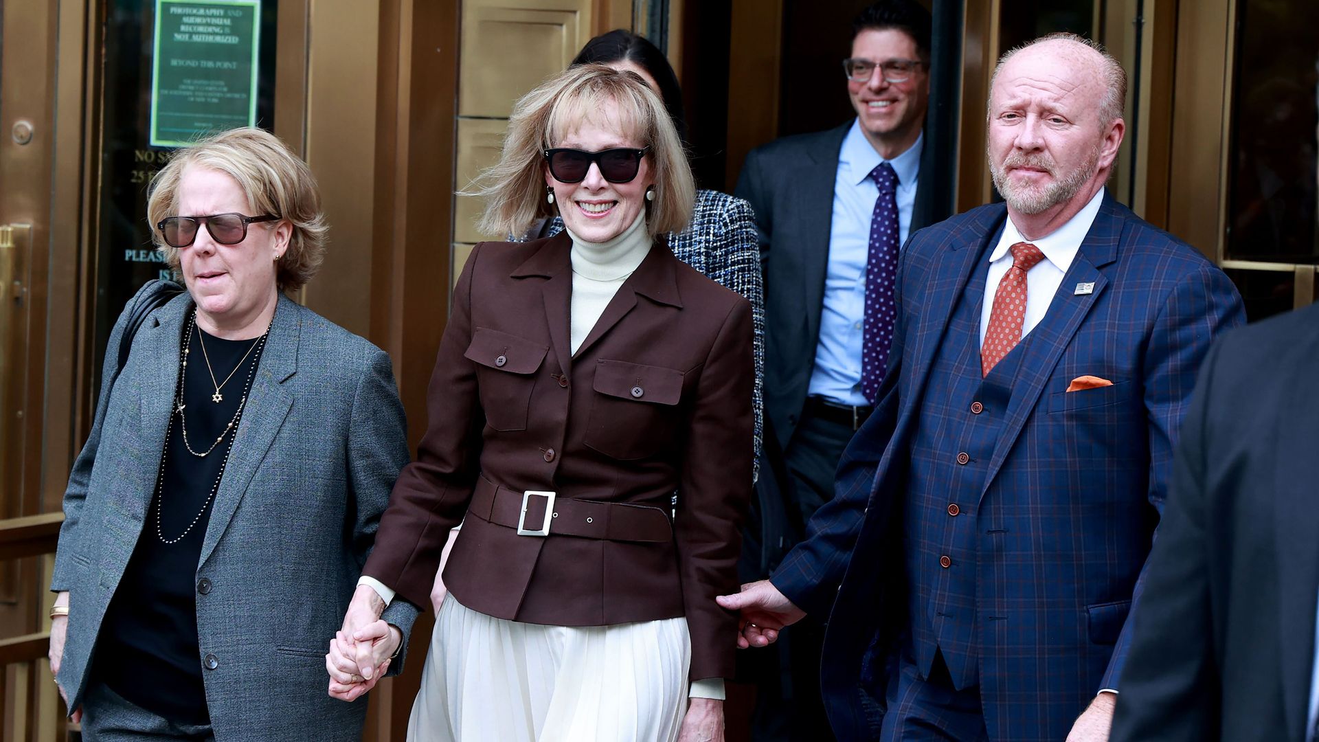 Writer E. Jean Carroll, middle, leaving a courthouse in May 2023.