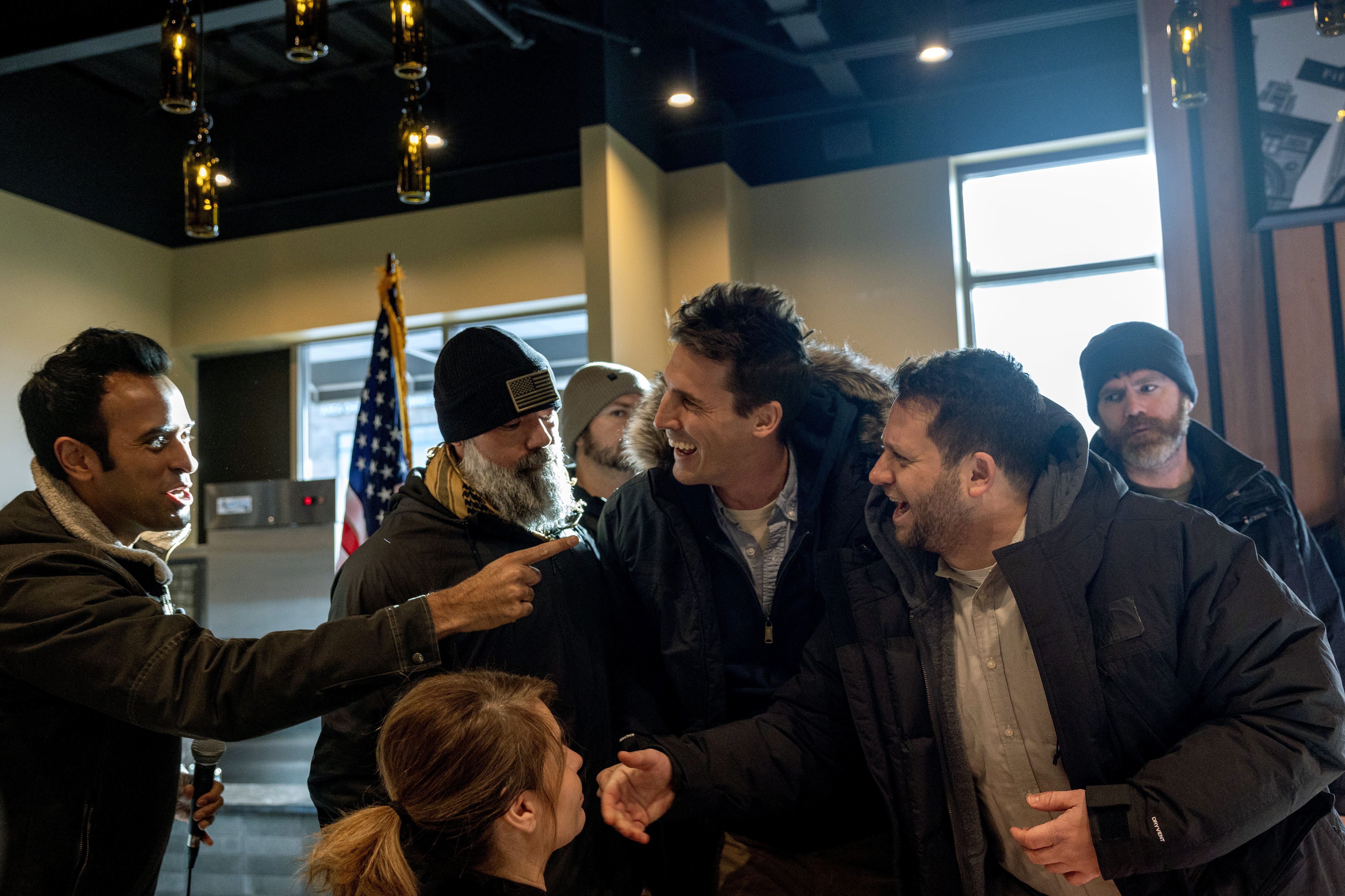 : Republican presidential candidate businessman Vivek Ramaswamy confronts protesters during a campaign stop on January 14, 2024 in Ankeny, Iowa. Republicans will be the first to select their party's nomination for the 2024 presidential race when they go to caucus on January 15, 2024.