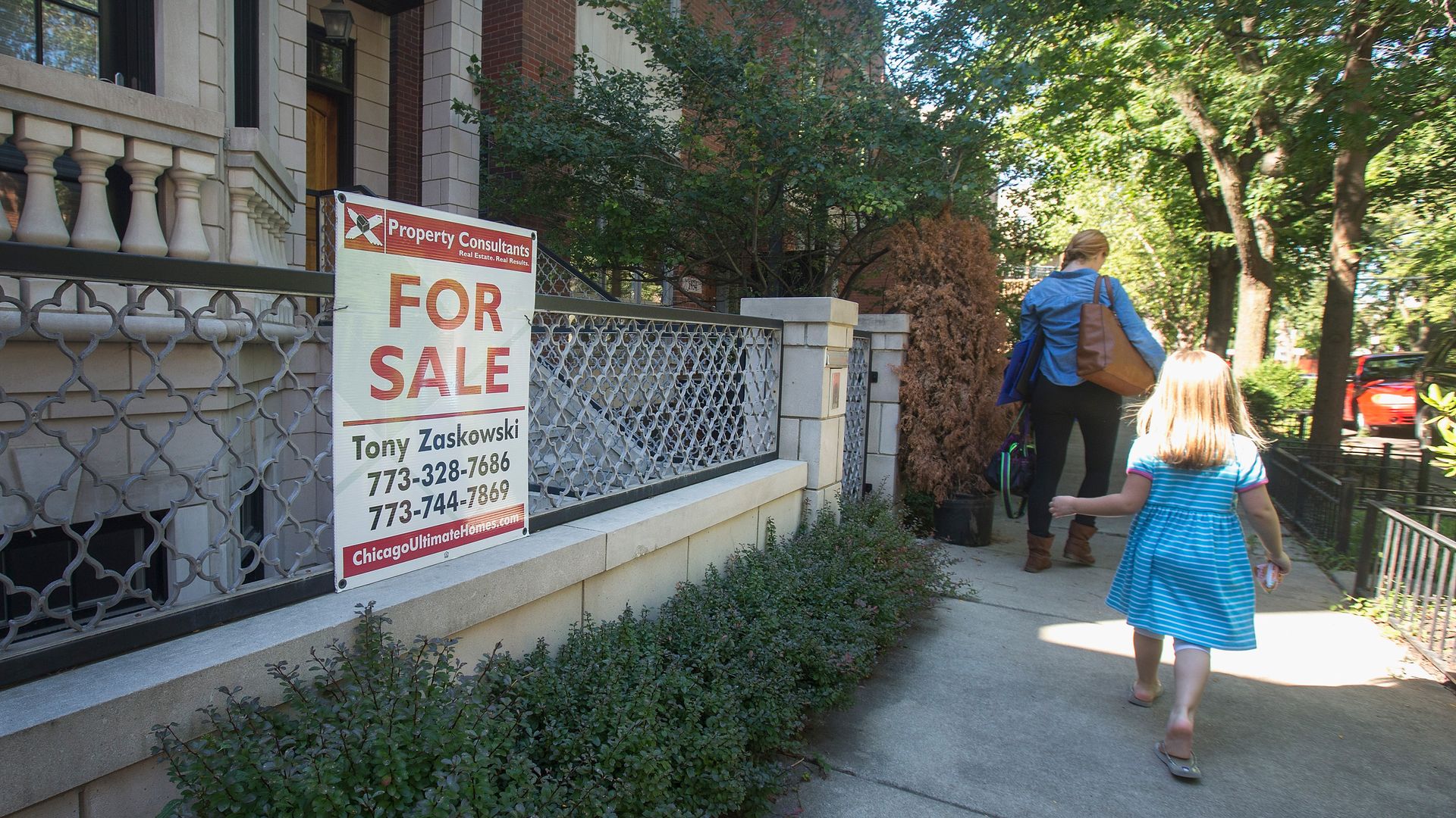 A "For Sale" sign on the front of a Chicago building. 