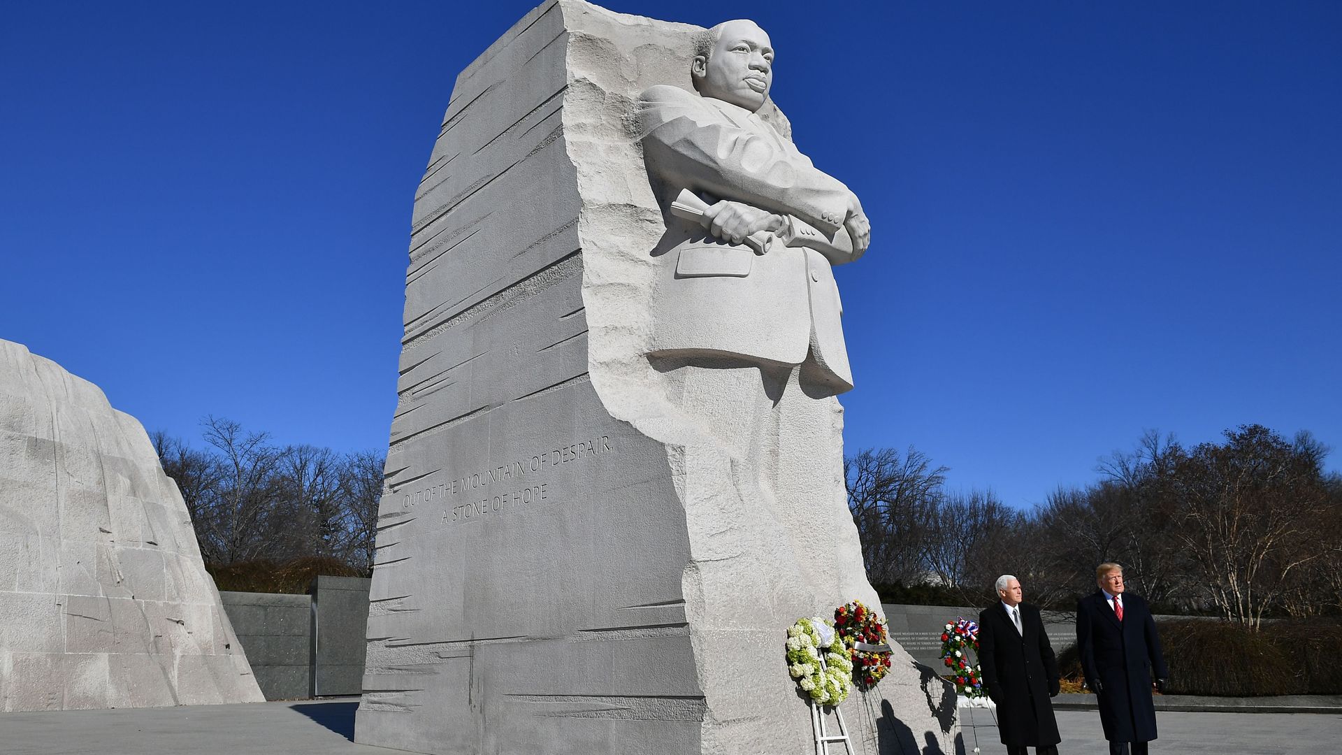President Trump and Vice President Mike Pence stand in front of the Martin Luther King statue at the King memorial