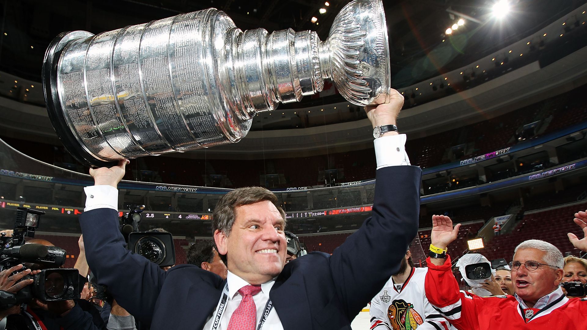 Chicago Blackhawks Chairman Rocky Wirtz holds up a Stanley Cup in 2010.
