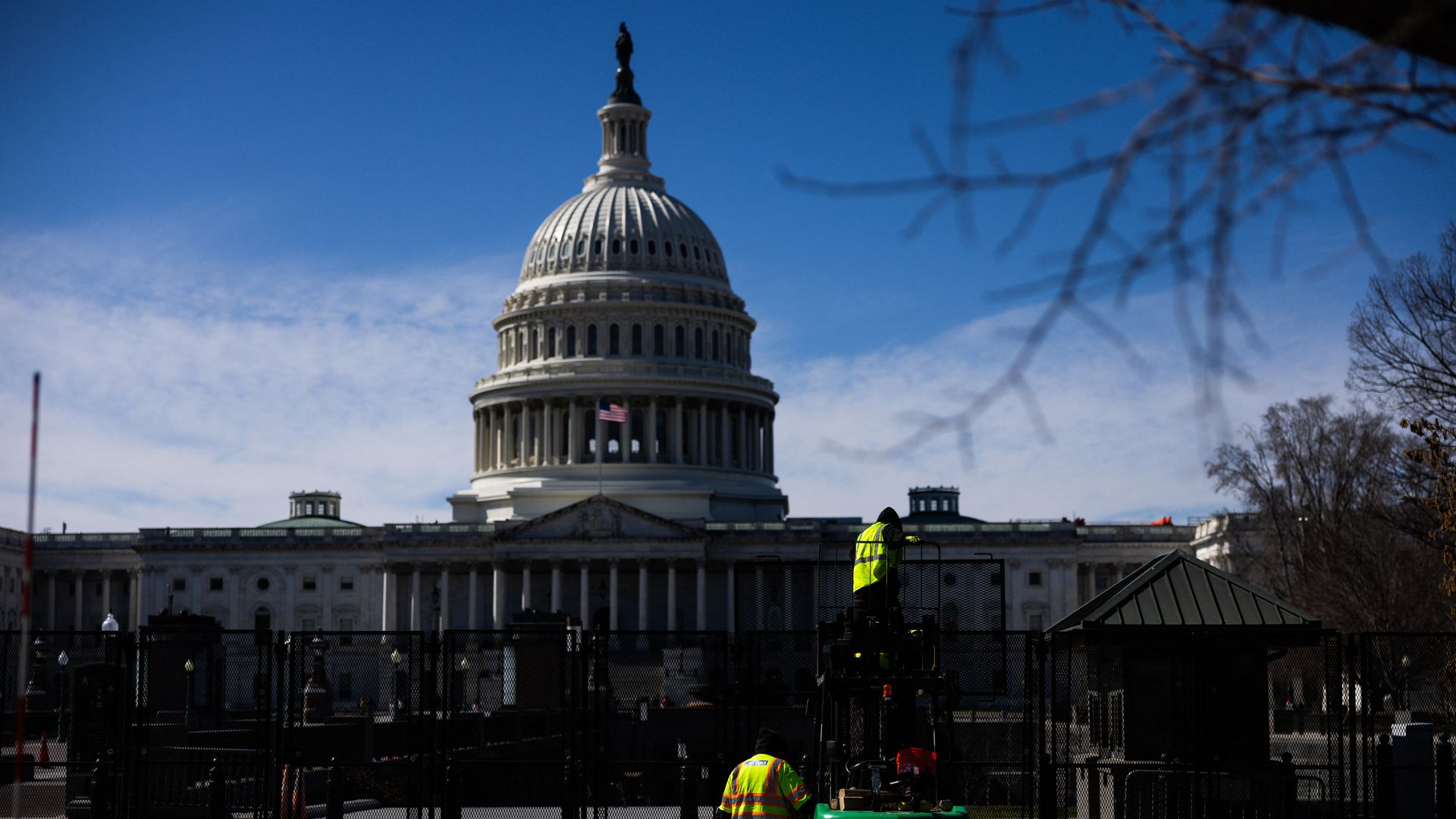 Workers put up security fencing at the US Capitol in Washington, DC on March 2, 2025, in advance of President Donald Trump's address to a joint session of Congress. 