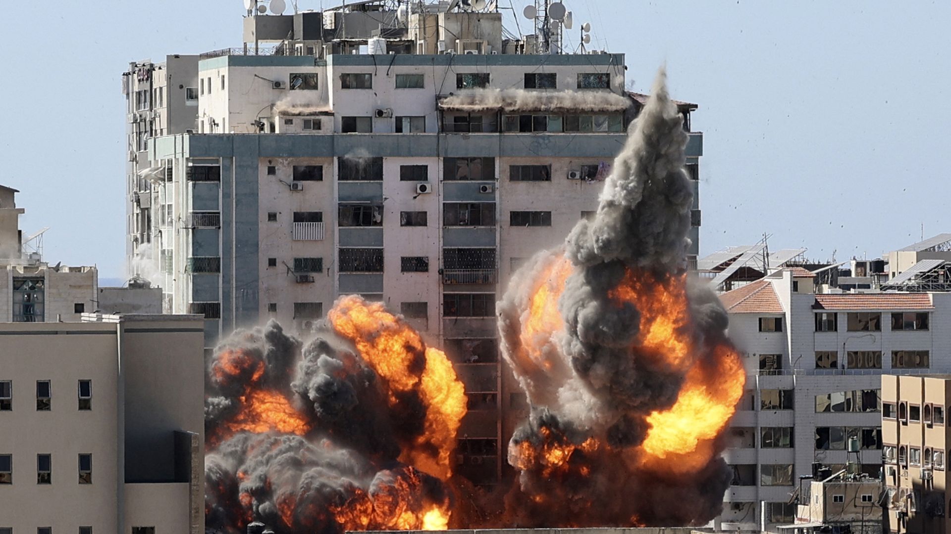  A ball of fire erupts from the Jala Tower as it is destroyed in an Israeli airstrike in Gaza city controlled by the Palestinian Hamas movement, on May 15