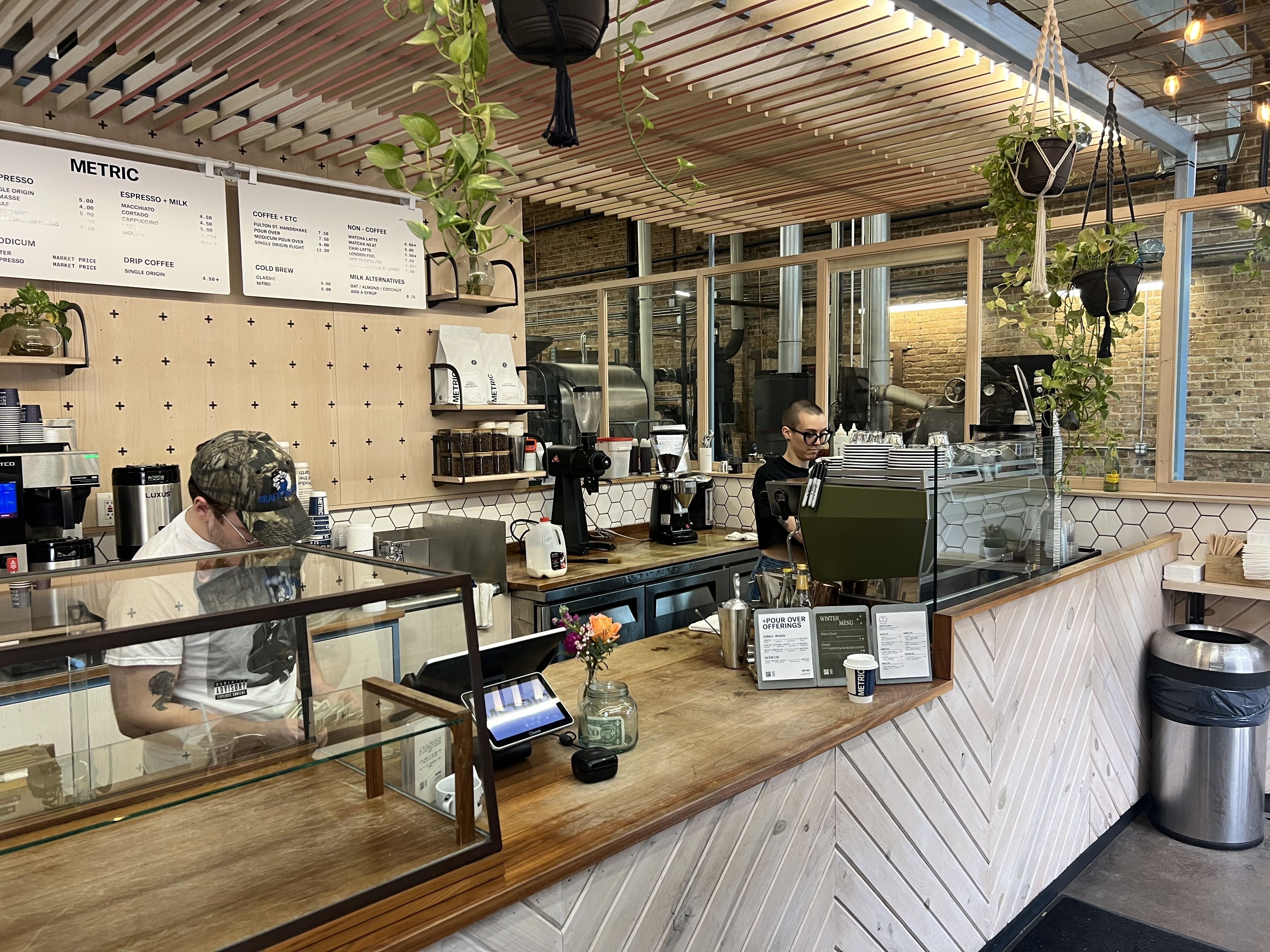 Baristas working behind a counter.