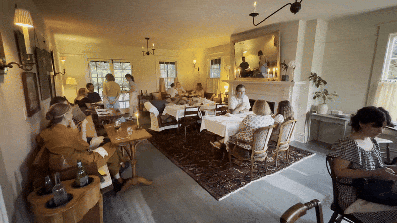 People sit in a restaurant dining room.
