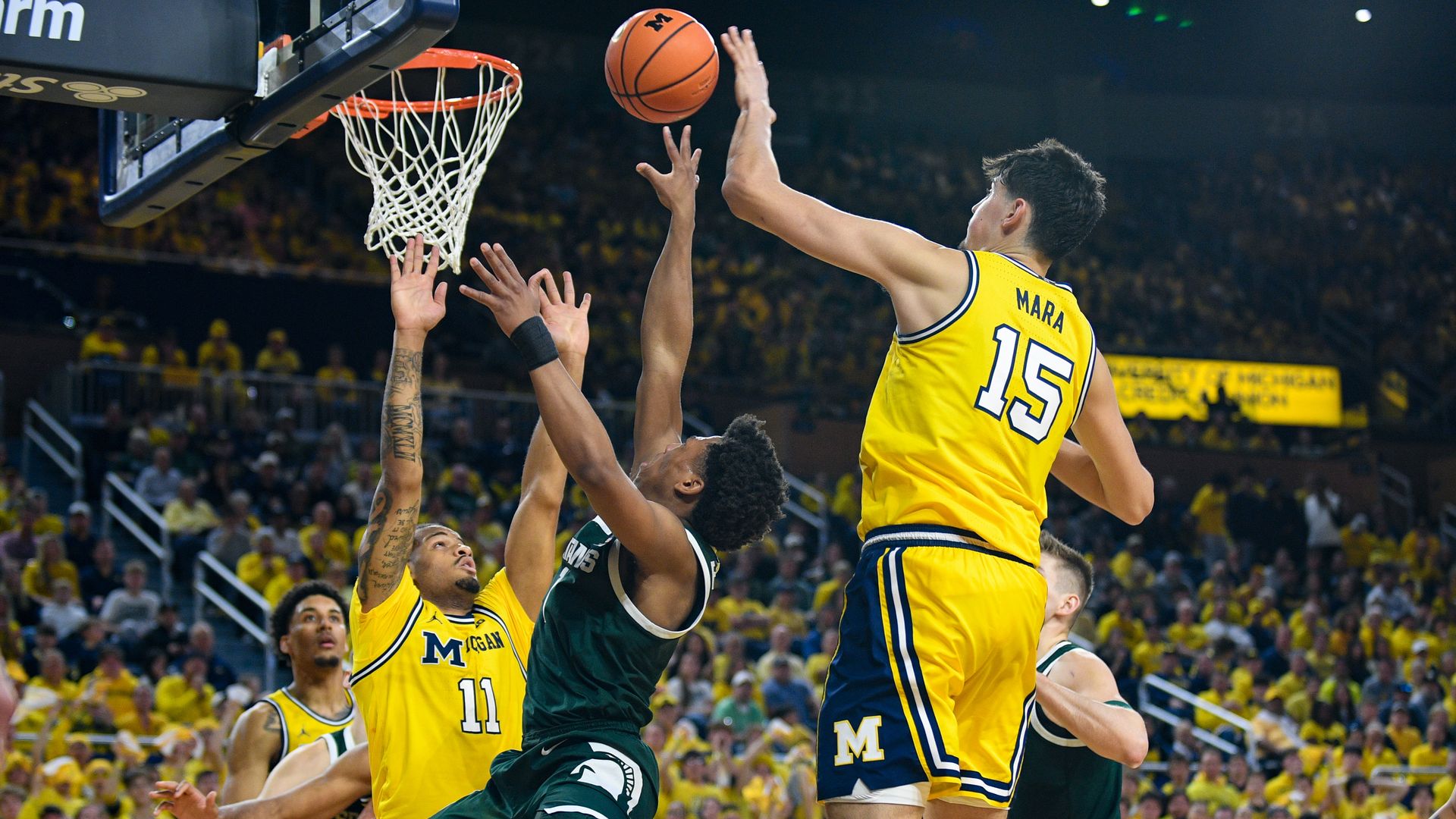 Michigan State's Jeremy Fears attempts a shot in traffic on Sunday at Crisler Center. 