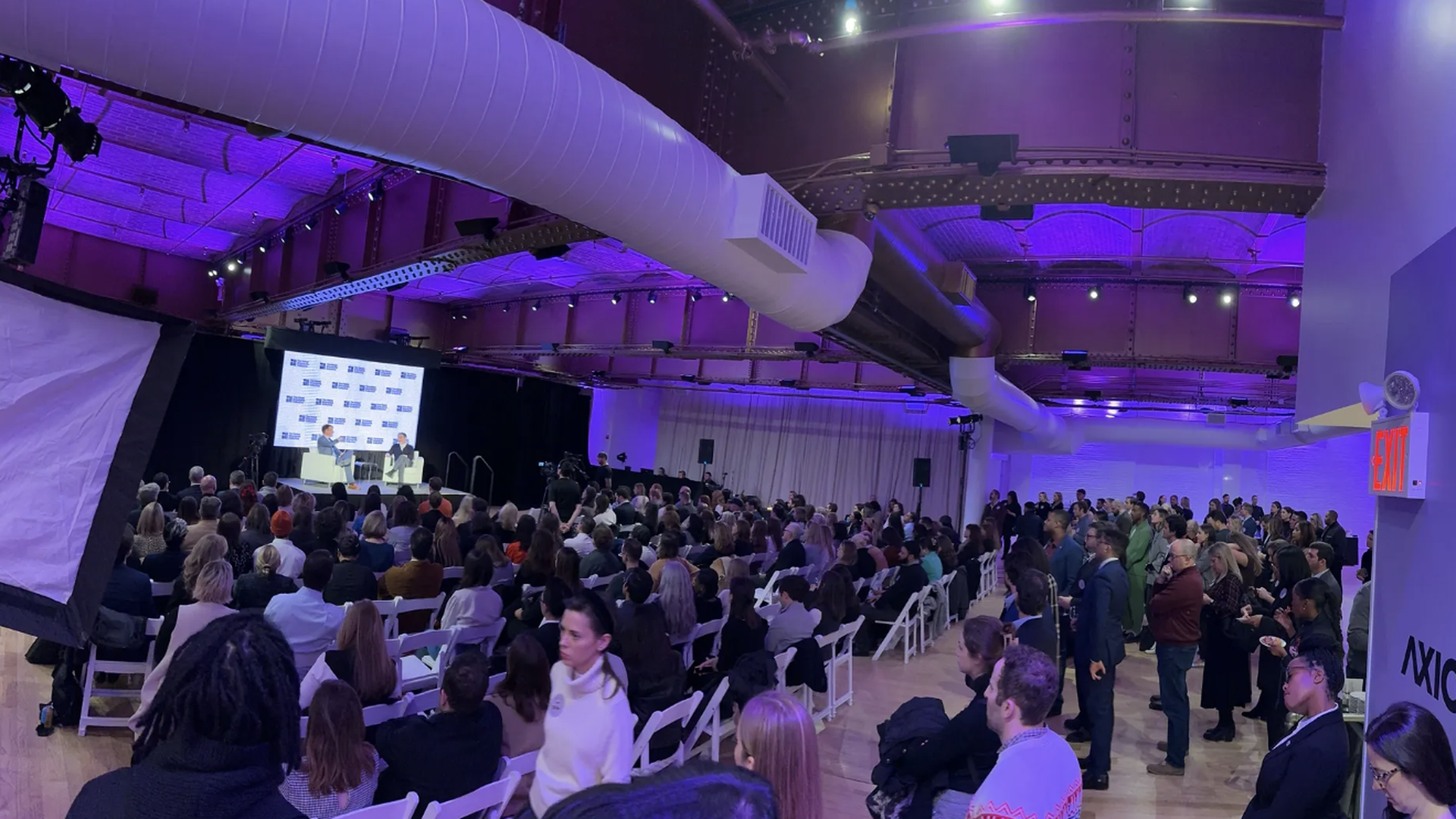 Axios publisher Nicholas Johnston speaks to Chris Perry, chairman of futures at Weber Shandwick, at the 2023 Axios Communicators event in New York. Photo: Ryan Heath/Axios