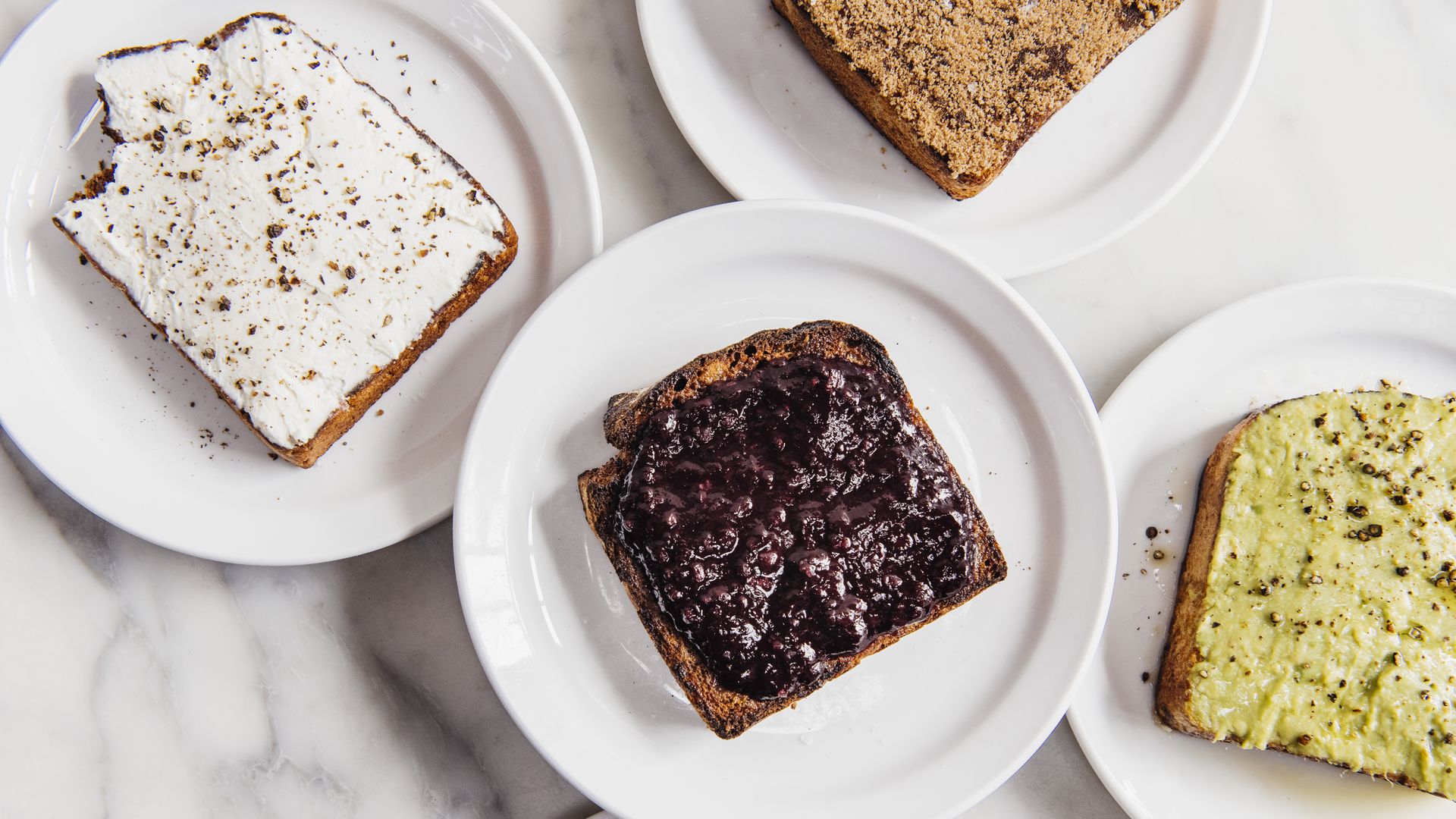 several types of toast arranged on plates