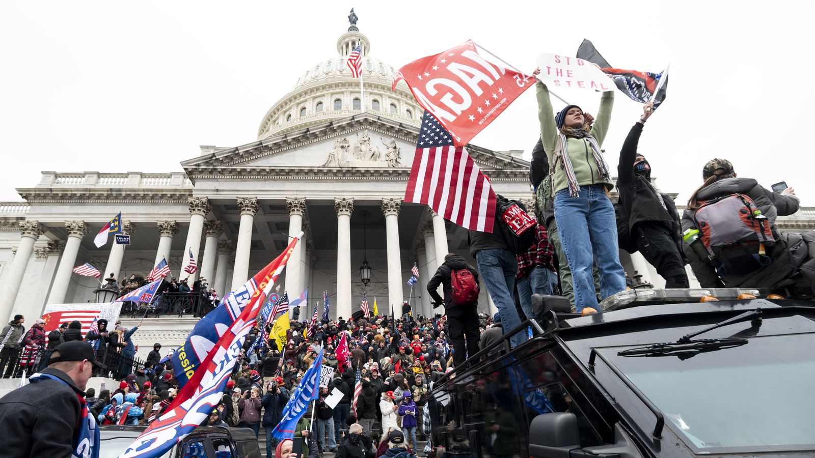 Capitol rioter who shoved officer with Confederate flag sentenced to 5 ...