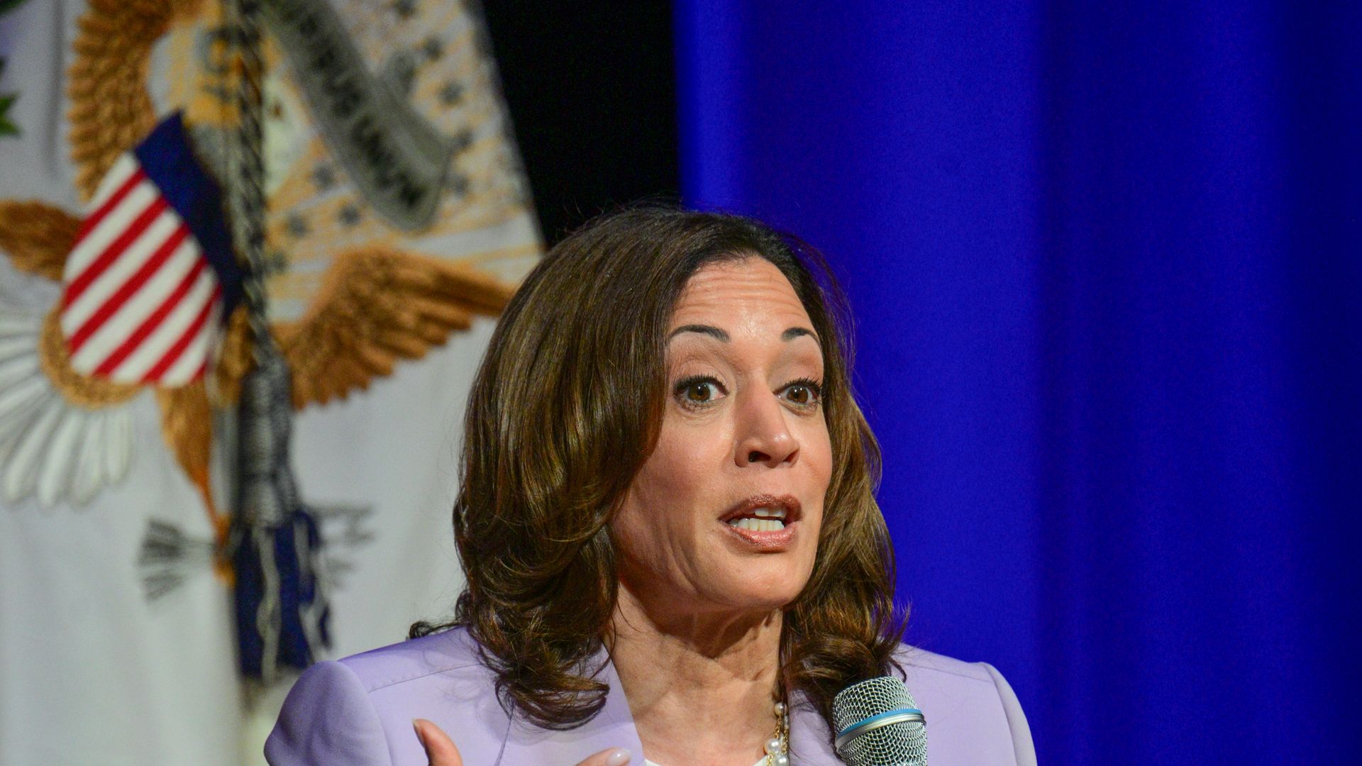 Kamala Harris talking while she is sitting down