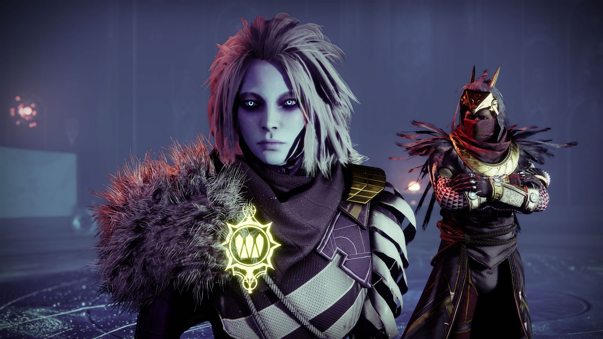 Image of two video game characters dressed in futuristic robes. The foreground character is a woman with blue skin.