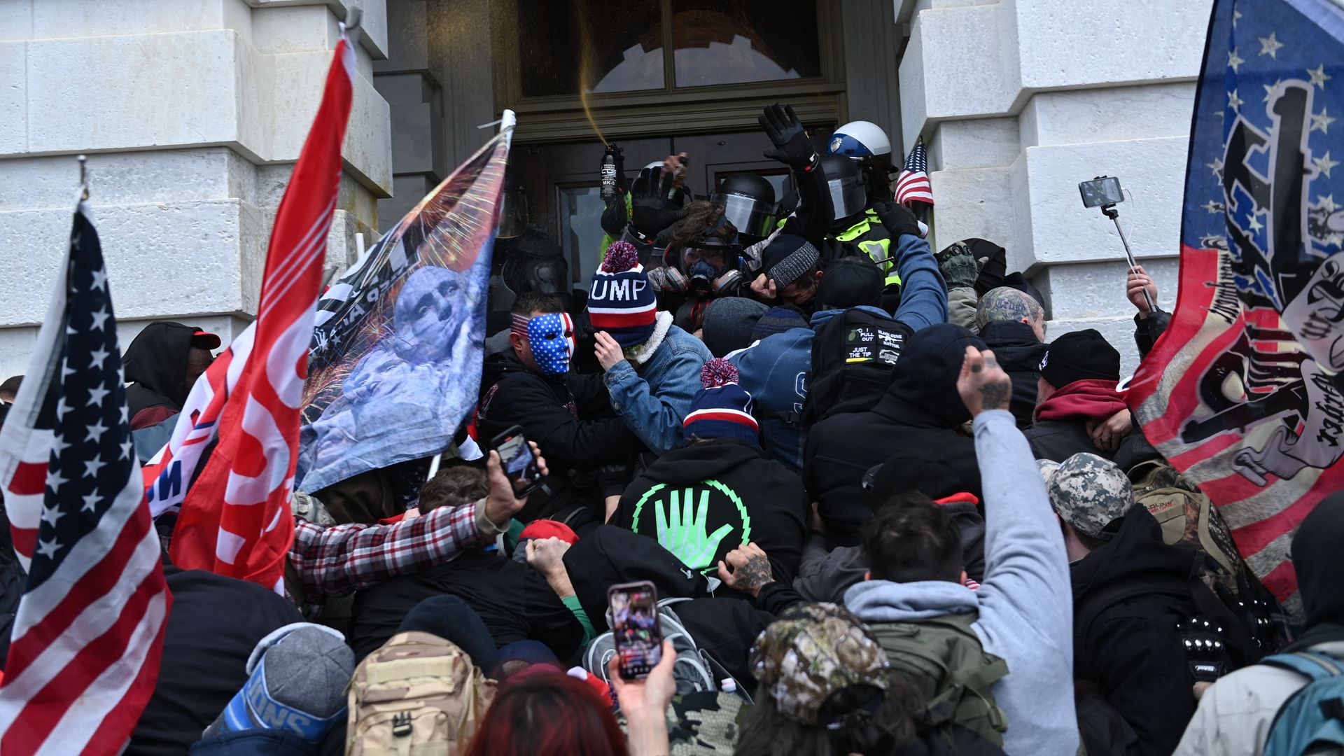Trump supporters clash with police and security forces as they storm the US Capitol in Washington, DC on January 6, 2021