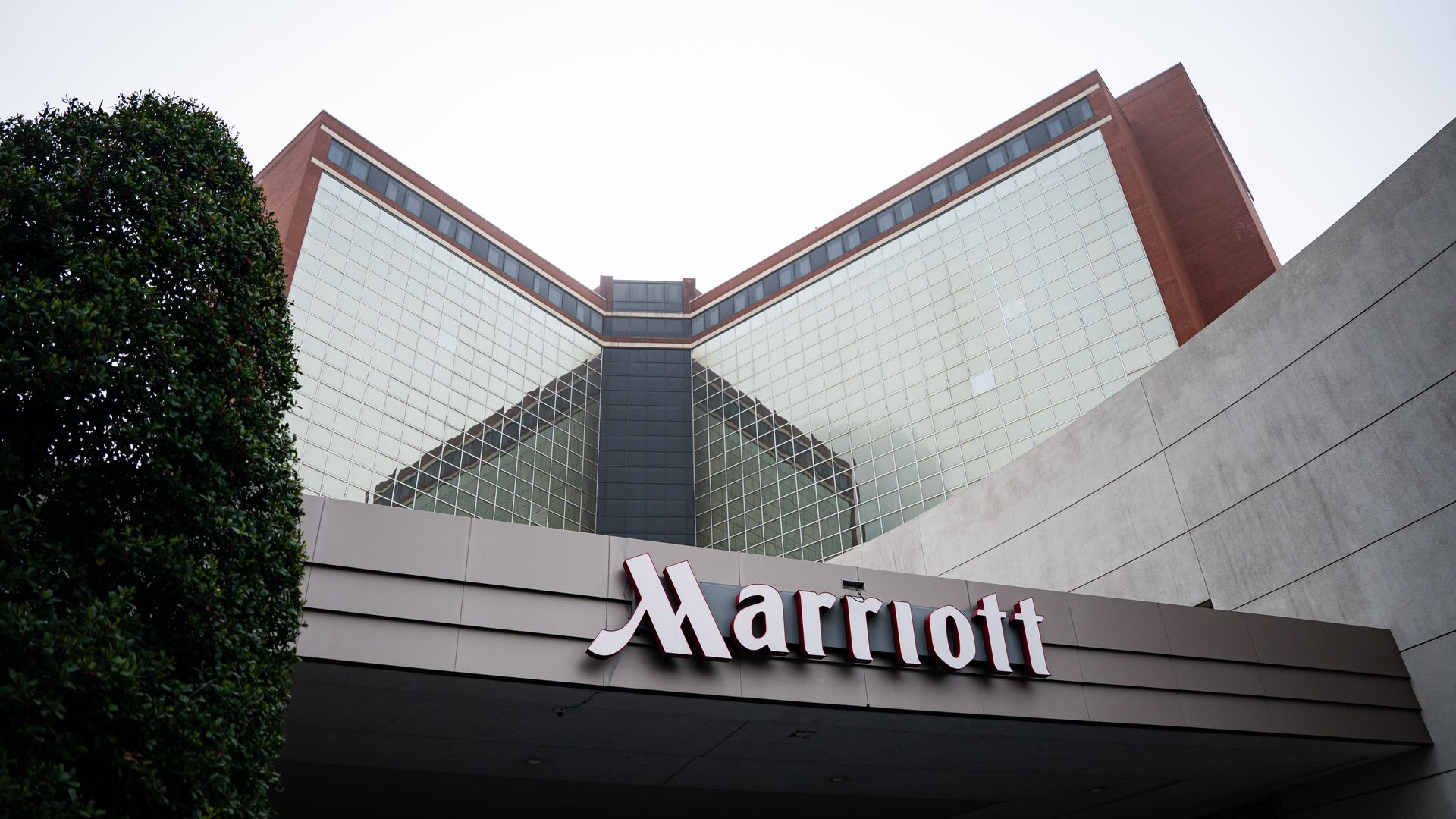 A Marriott hotel with a mirrored glass exterior