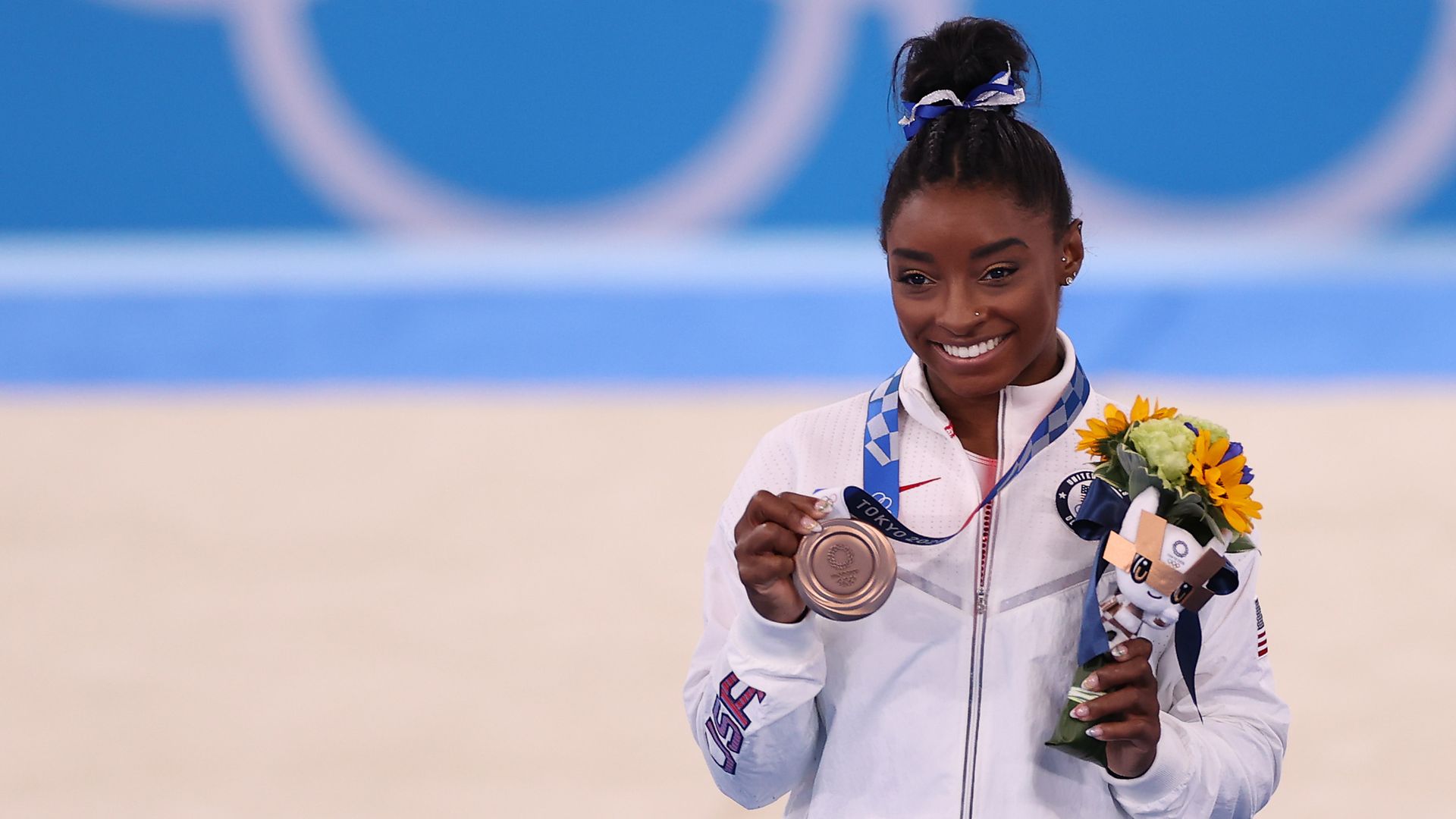 American Simone Biles with the bronze medal at the Olympic Women's Balance Beam Final medal ceremony in Tokyo, Japan, on Aug. 3.