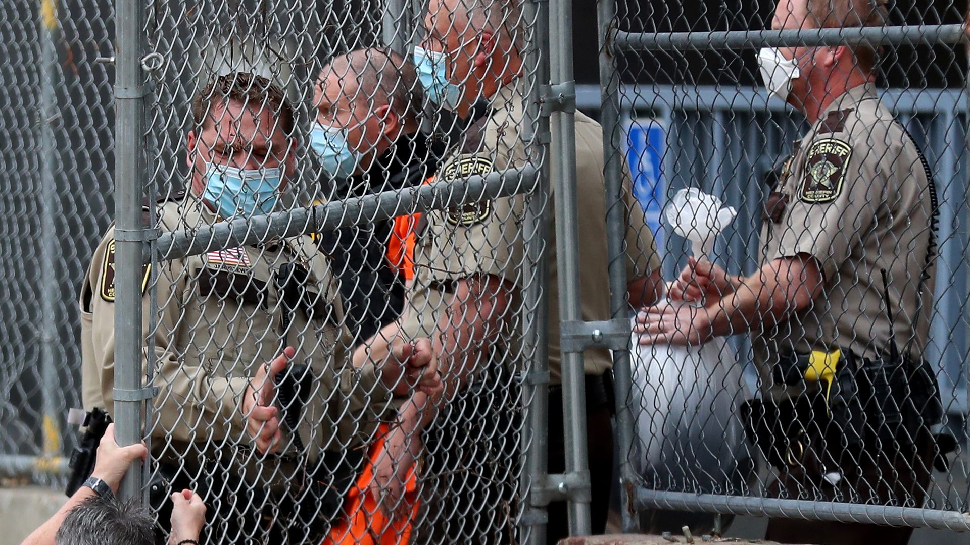 Law enforcement officials escorting former Minneapolis police officer Derek Chauvin from a prison in Minneapolis in September 2020.