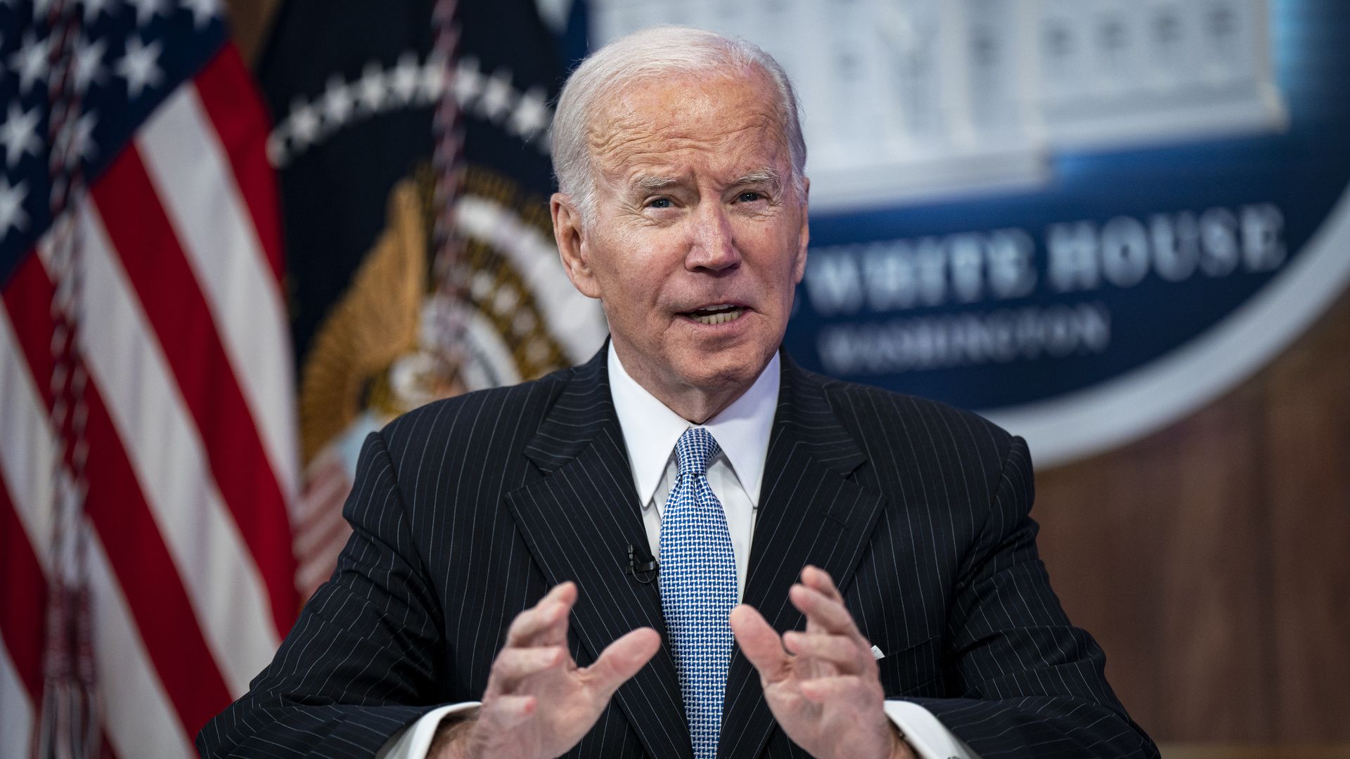 Photo of Joe BIden speaking while gesturing with both hands