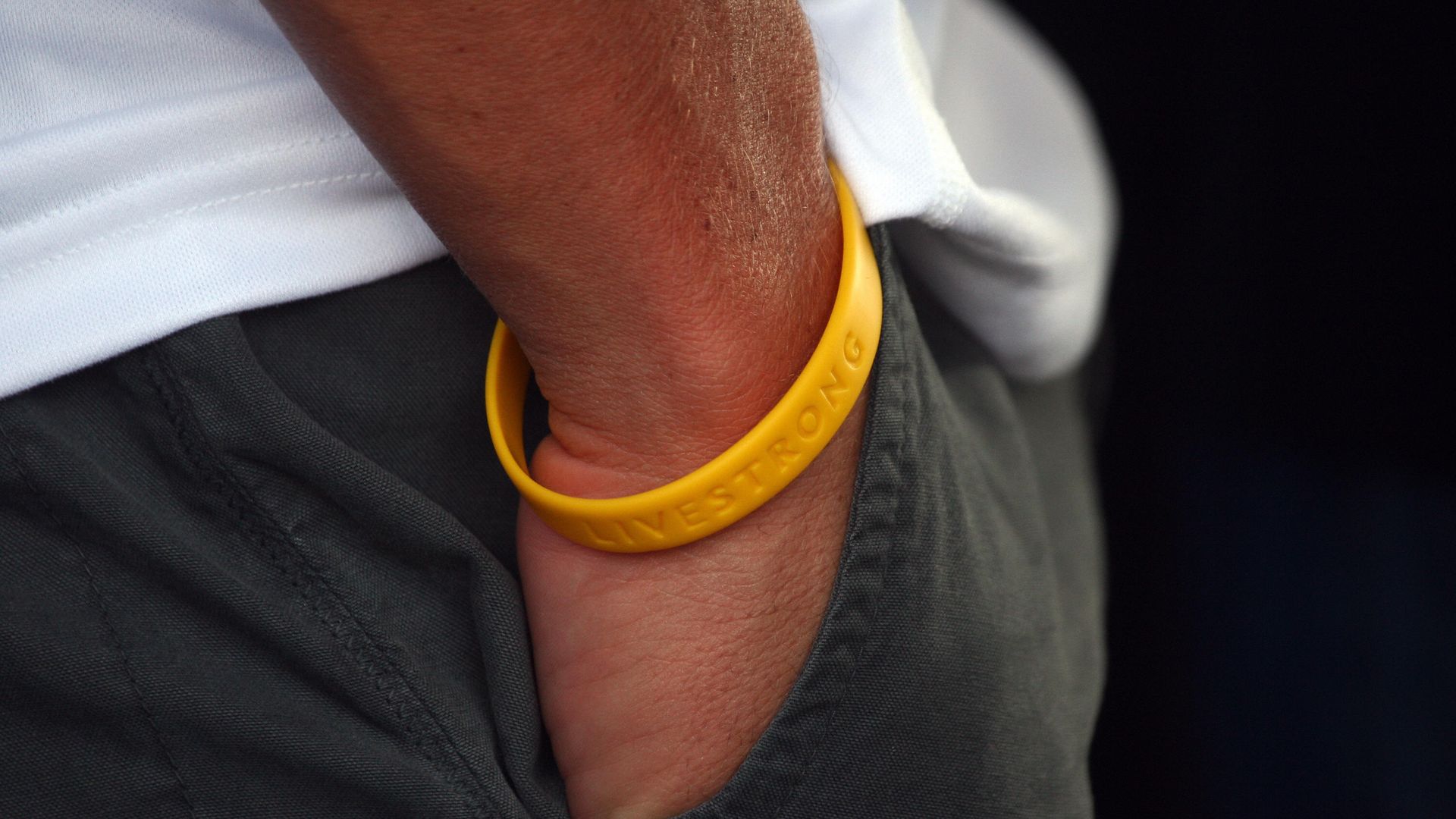 A Livestrong bracelet on the wrist of Lance Armstrong.