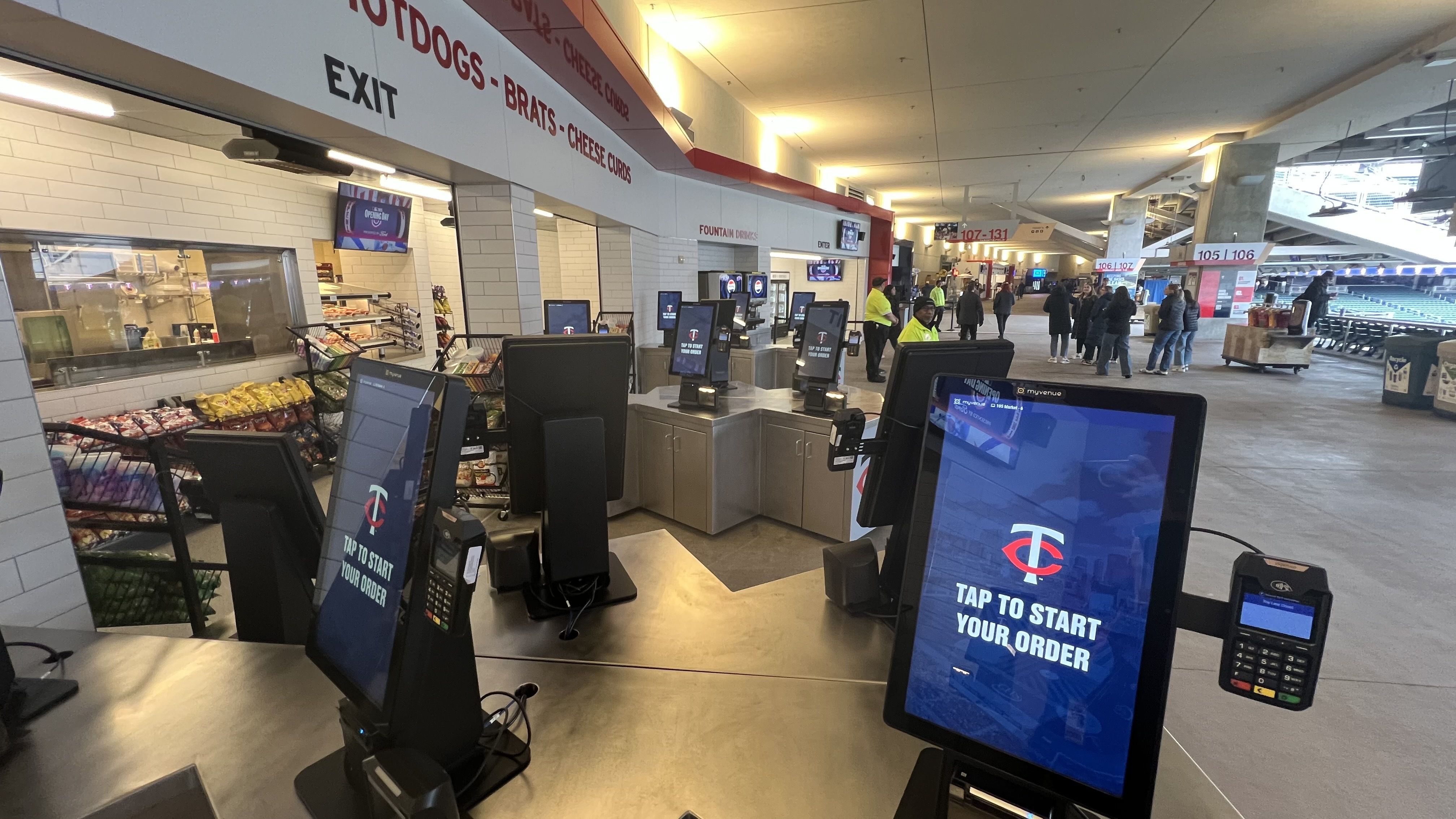 A self-checkout concession stand in the concourse of a baseball stadium