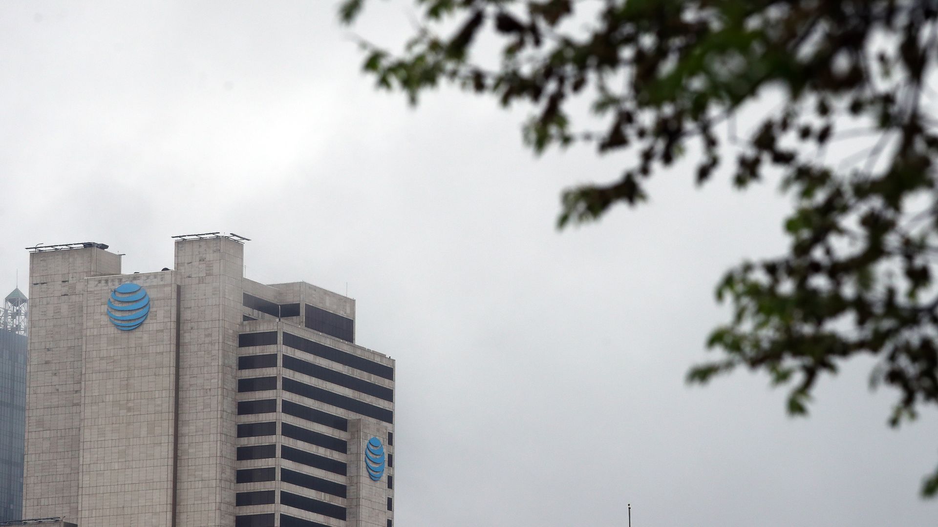 A tall building with a blue AT&T logo toward the top