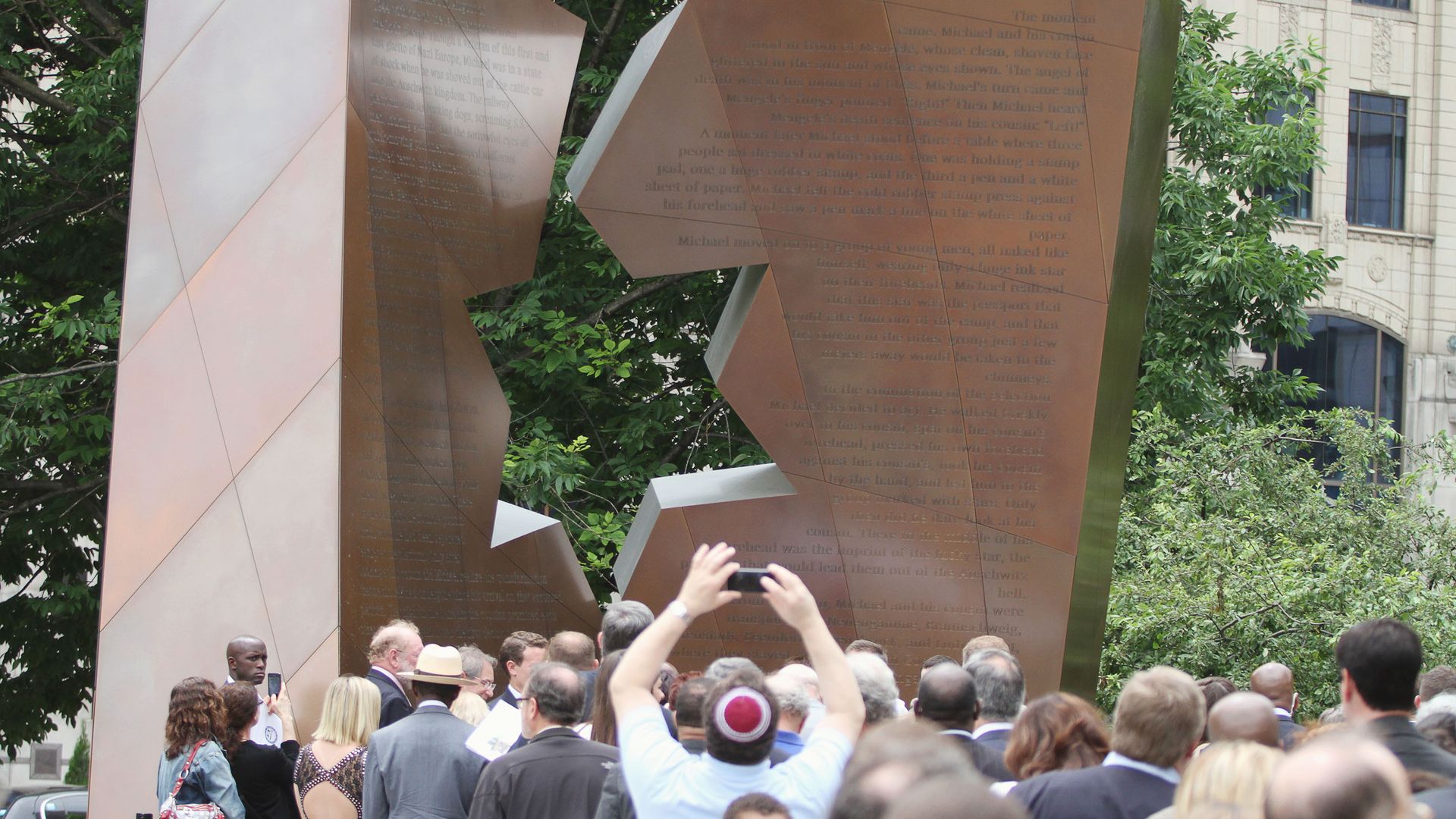 A crowd gathers near a Holocaust memorial in Ohio.