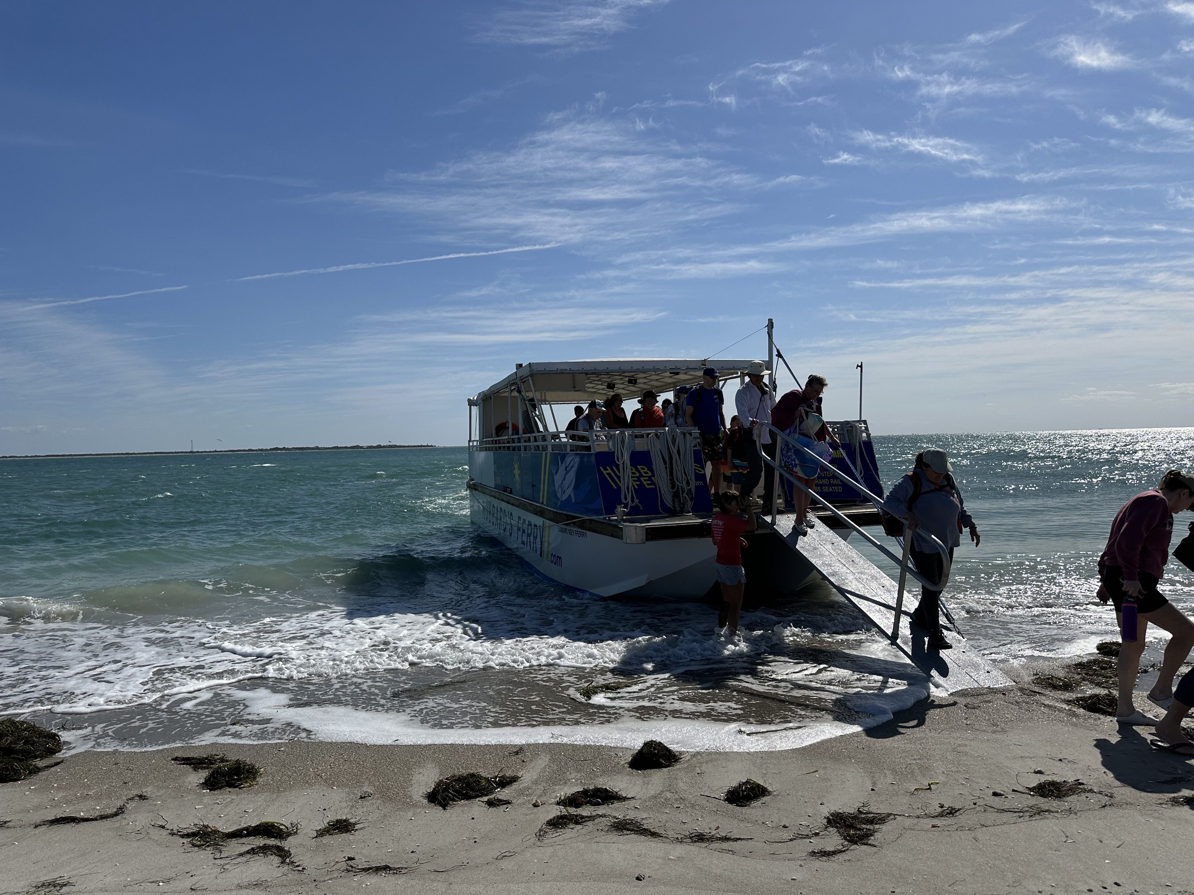 People getting off the small ferry for Egmont Key. 