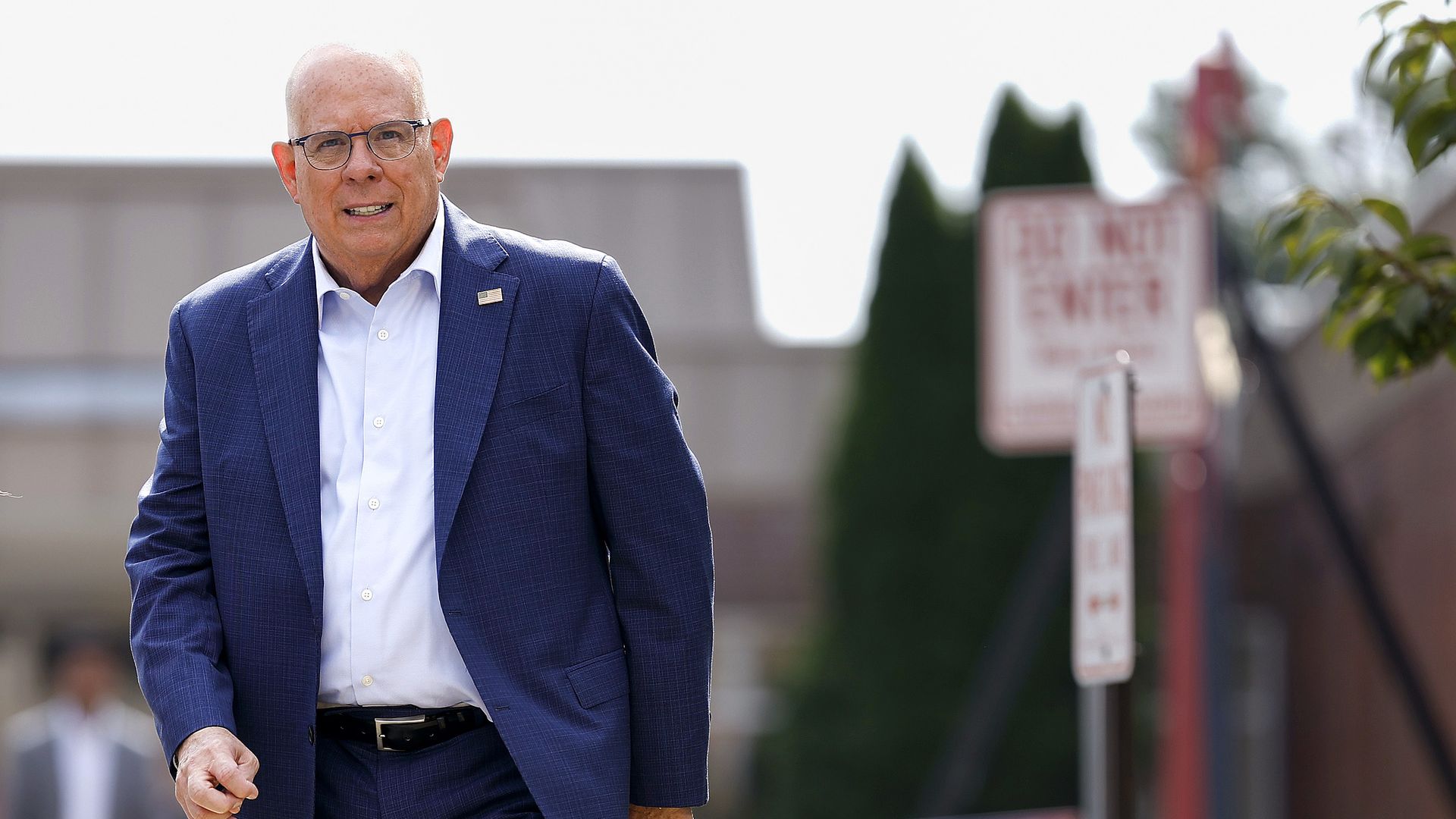 Maryland Senate Candidate Larry Hogan arrives to speak to the media after visiting Paint Branch Elementary School