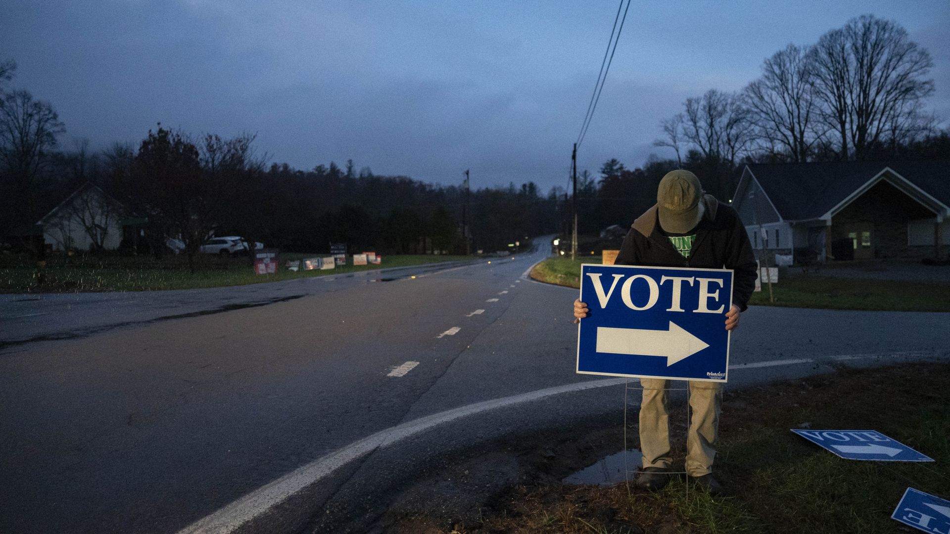 A poll worker setting up a vote sign in North Carolina.