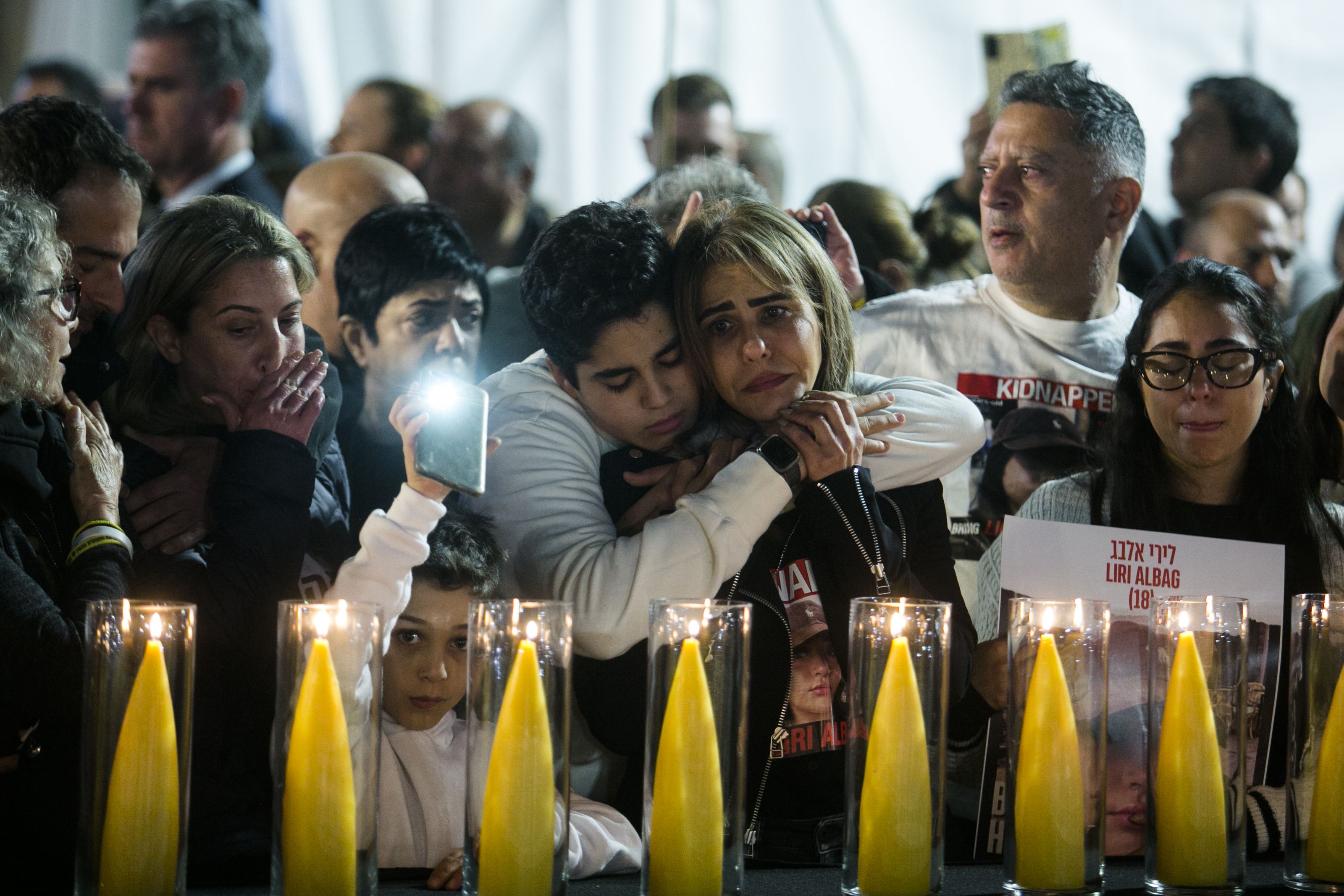 An image of families at a public Hannukah celebration held in support of Israeli hostages. 