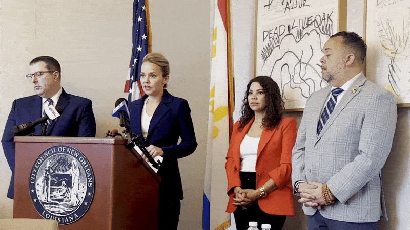 Image show City Councilmembers Joe Giarrusso, Helena Moreno, Lesli Harris and JP Morrell behind a podium.
