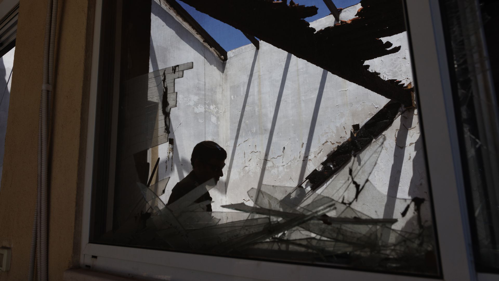 An Israeli soldier in a house damaged by an Hezbollah anti-tank missile near the Lebanon border in Kibbutz Hanita, northern Israel, on Wednesday, June 19, 2024.