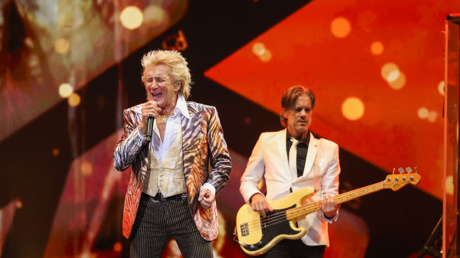 Rod Stewart performing on stage.