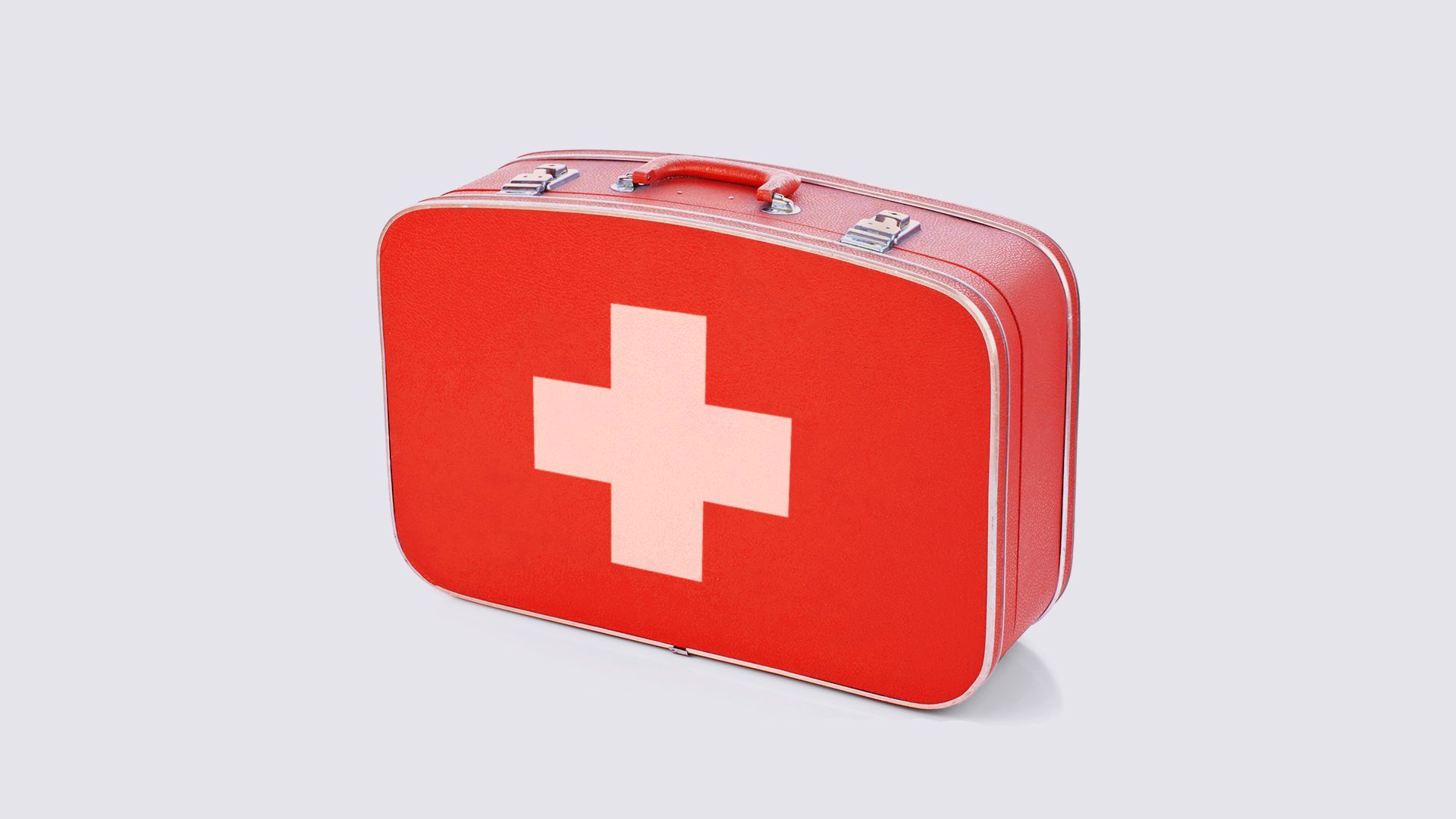Illustration of a red suitcase with a medical cross on the side
