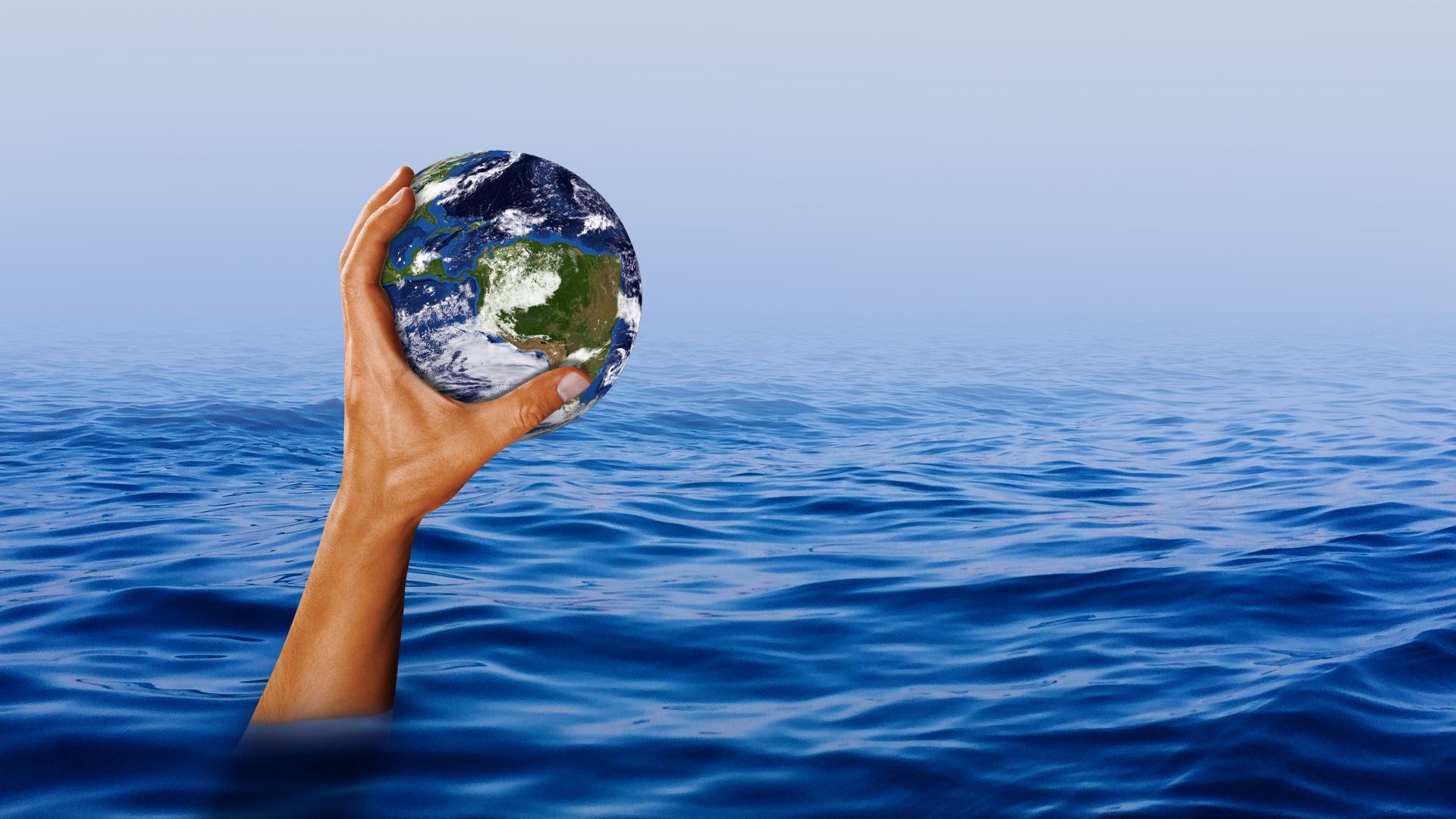 Illustration of a hand holding up an Earth above rising water. 
