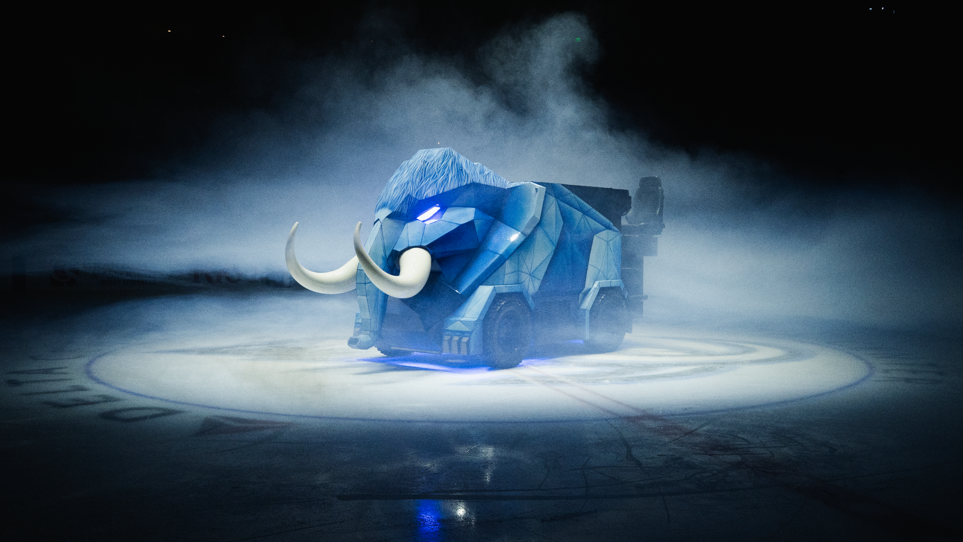 An ice rink Zamboni is costumed as a blue wooly mammoth